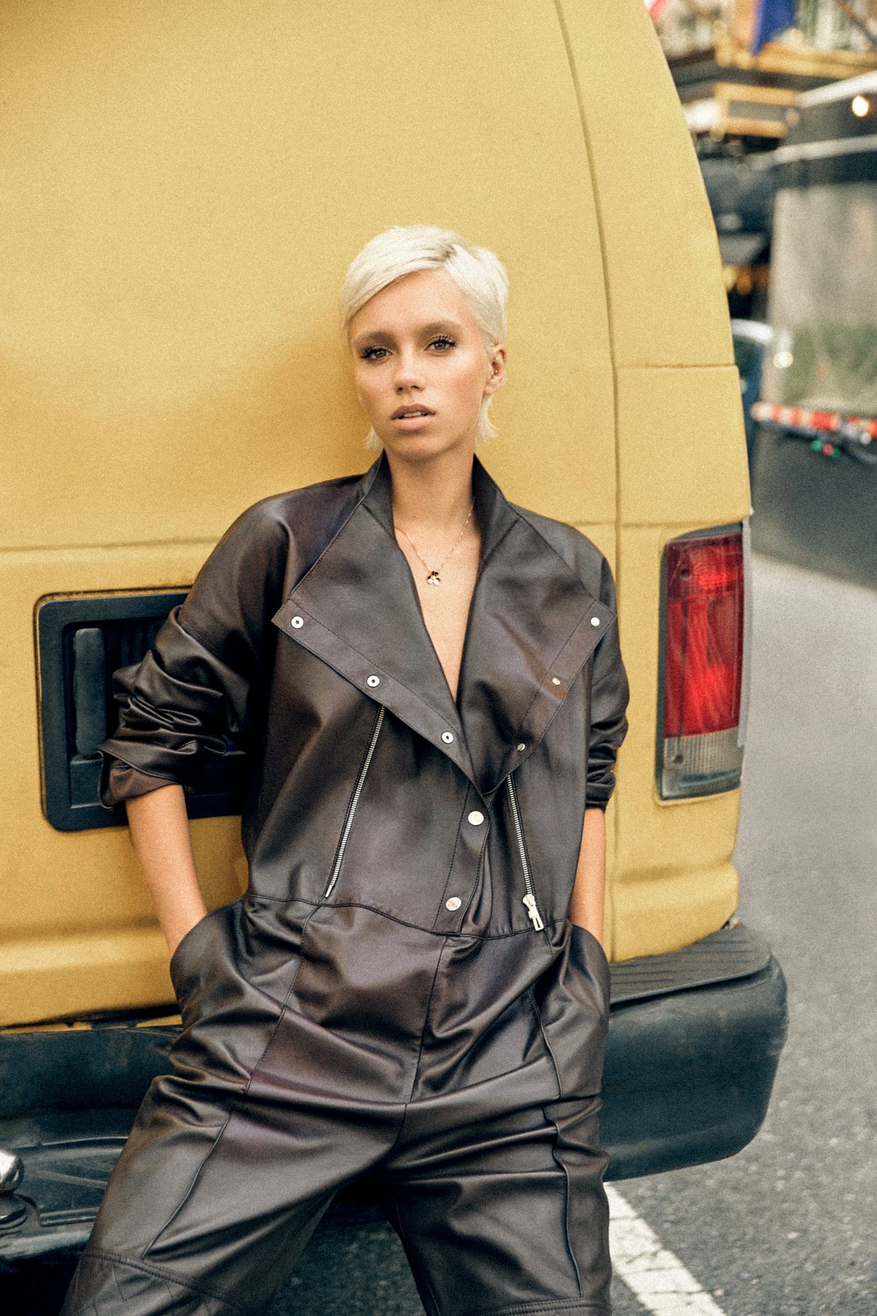 Automotive design, Motor vehicle, Leather jacket, Fashion, Sleeve, Car, Waist, Eyewear