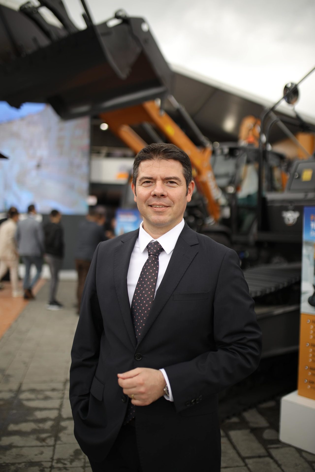 Dress shirt, Automotive design, Smile, Coat, Gesture, Tie, Collar, Suit