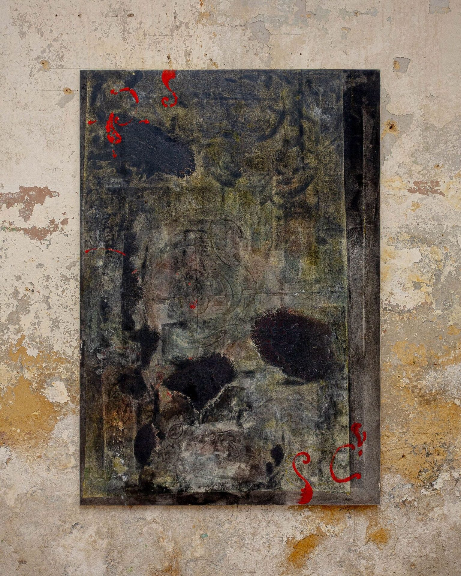 Dark abstract painting with red ornate marks on a textured wall.