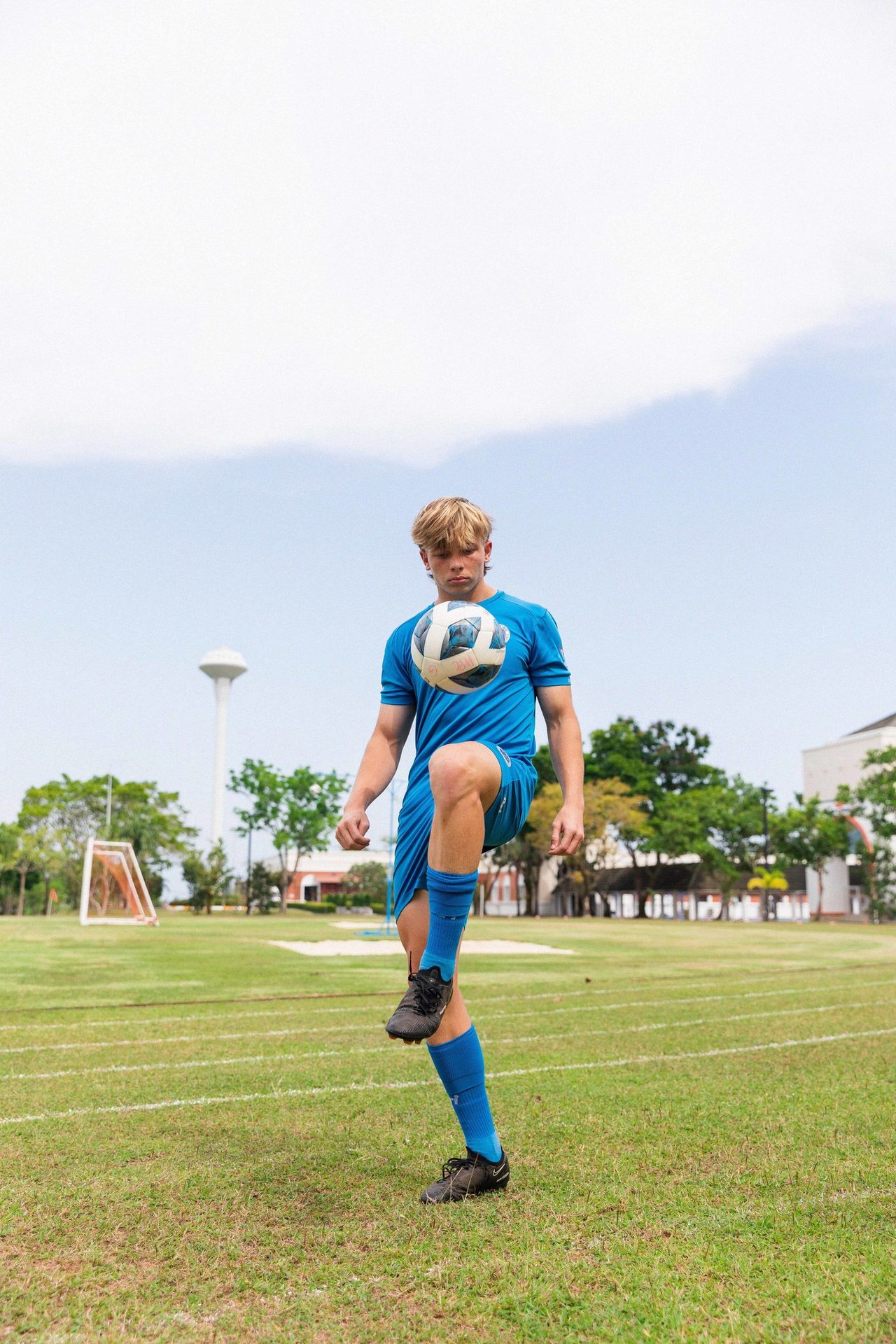 People in nature, Sports uniform, Sky, Plant, Shorts, Cloud, Tree, Football, Ball