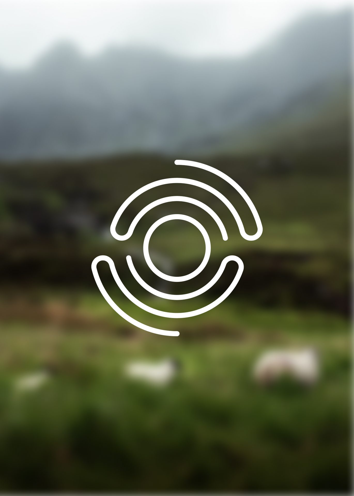 White abstract circular logo on a blurred green mountain landscape with sheep.