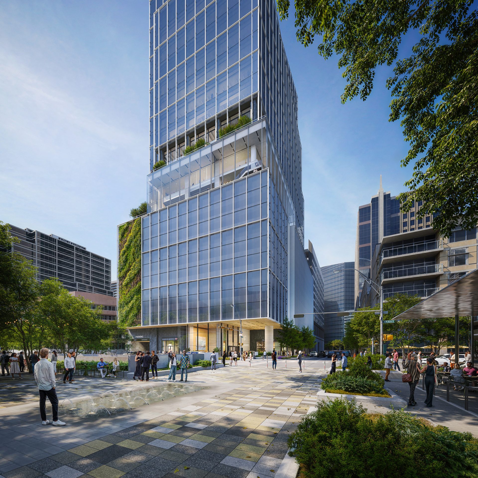 Modern glass skyscraper with a green wall overlooking a bustling urban plaza with people and trees.
