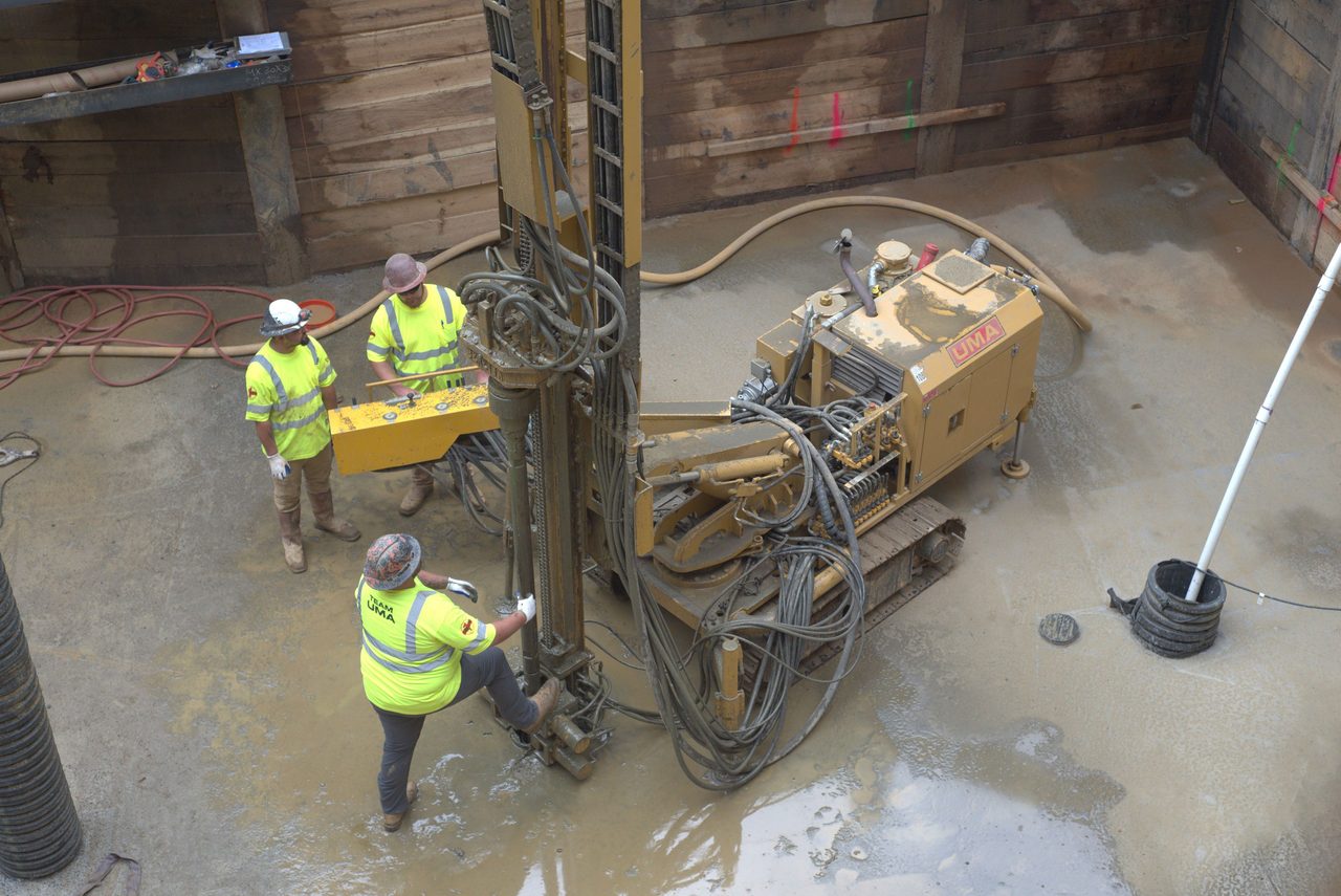 High-visibility clothing, Hard hat, Road surface, Workwear, Helmet, Water, Asphalt, Tradesman, Floor, Vehicle