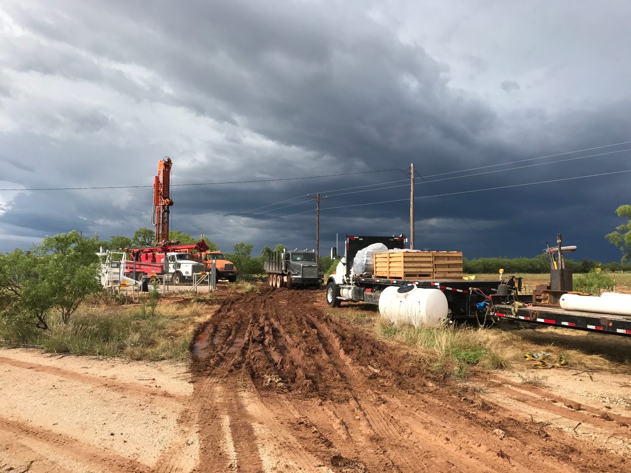 Land lot, Road surface, Cloud, Sky, Asphalt, Vehicle, Truck, Plant, Electricity