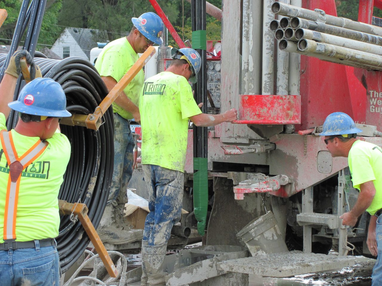 Hard hat, High-visibility clothing, Natural environment, Jeans, Workwear, Tradesman, Helmet, Green, Engineer