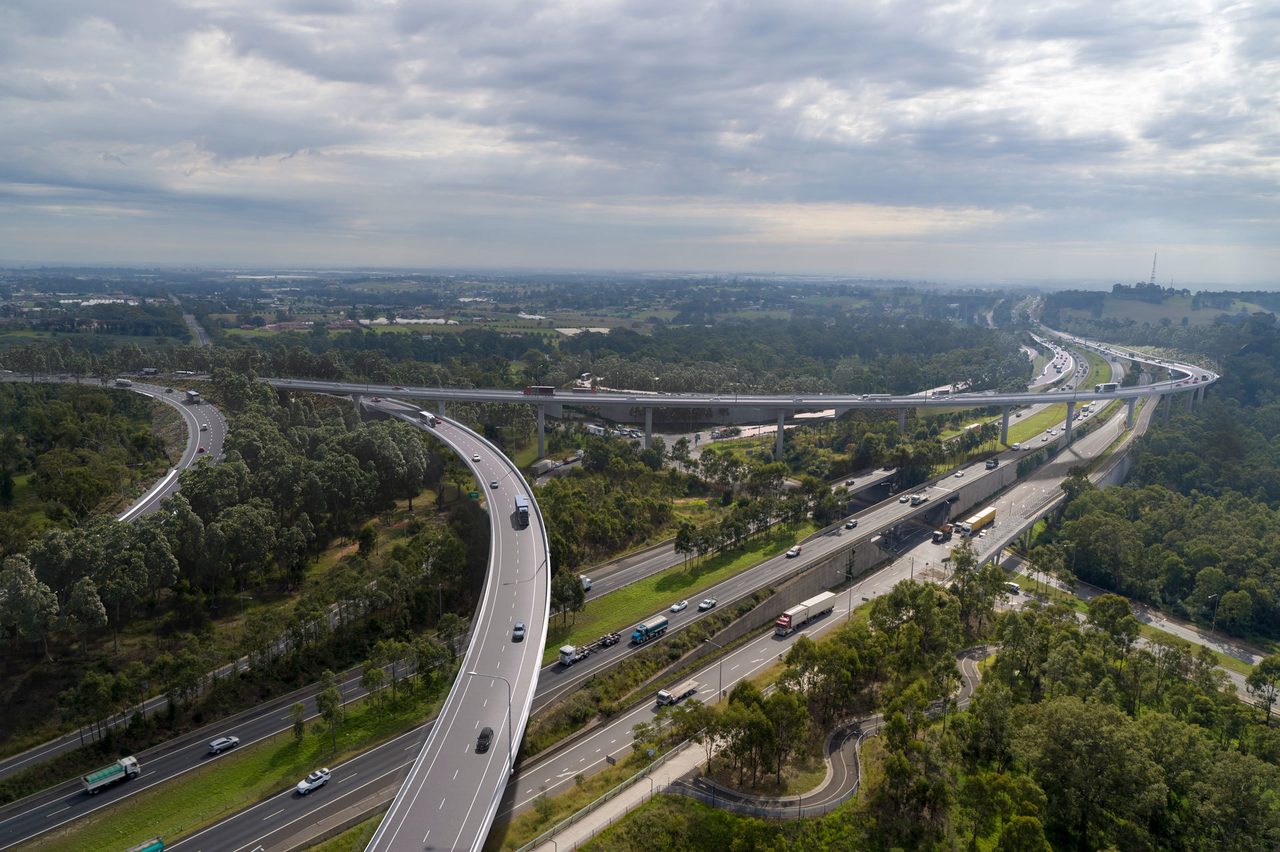 Road surface, Urban design, Sky, Cloud, Infrastructure, Tree, Car, Asphalt, Architecture, Thoroughfare