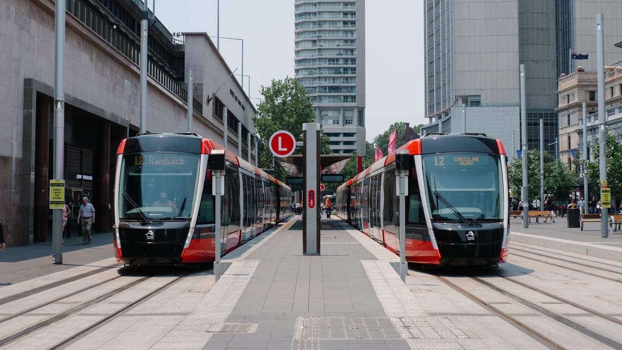 Mode of transport, Motor vehicle, Rolling stock, Street light, Train, Building, Infrastructure, Electricity, Tree