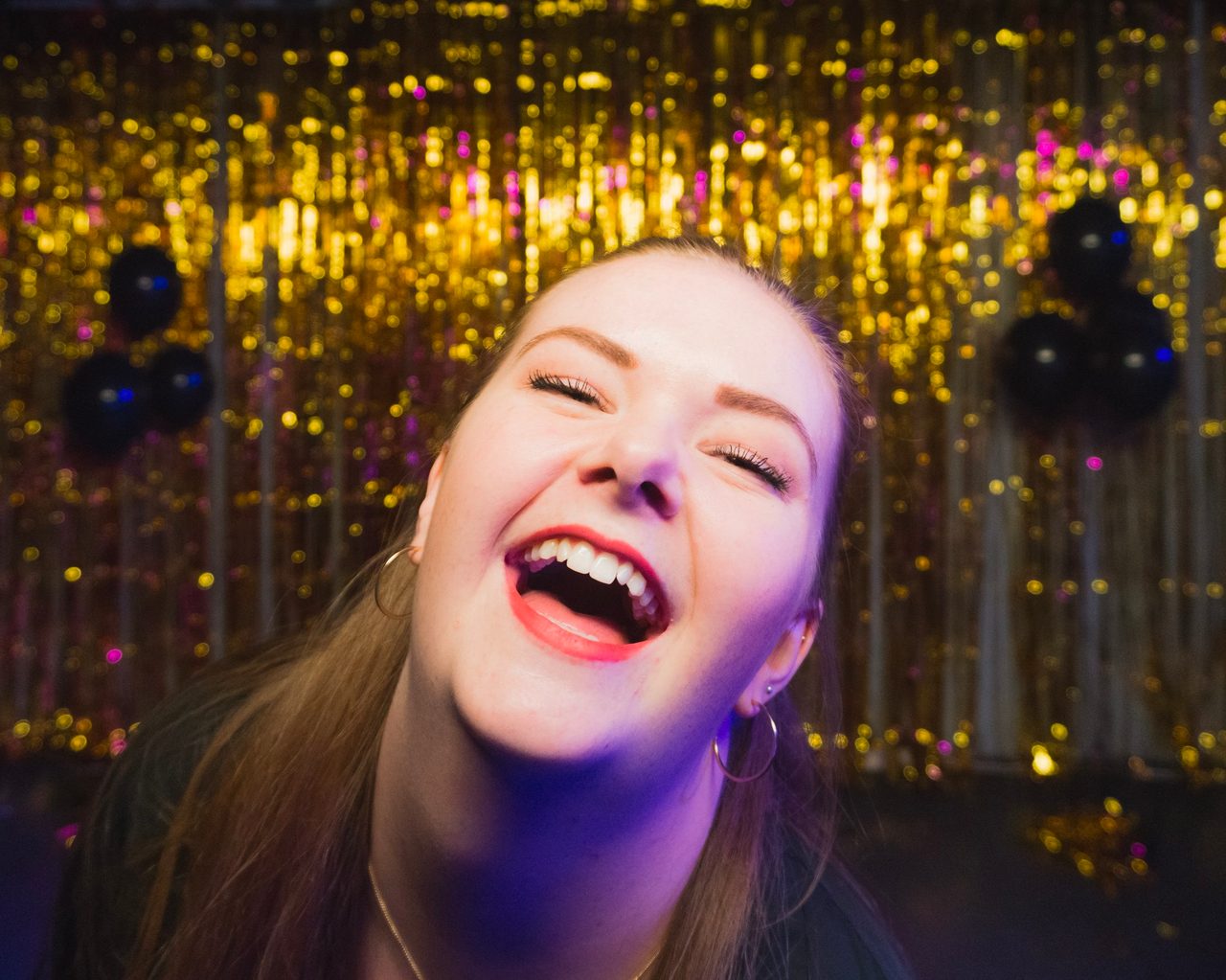 Flash photography, Lip, Smile, Plant, Hairstyle, Purple, Human, Happy, Microphone, Tree