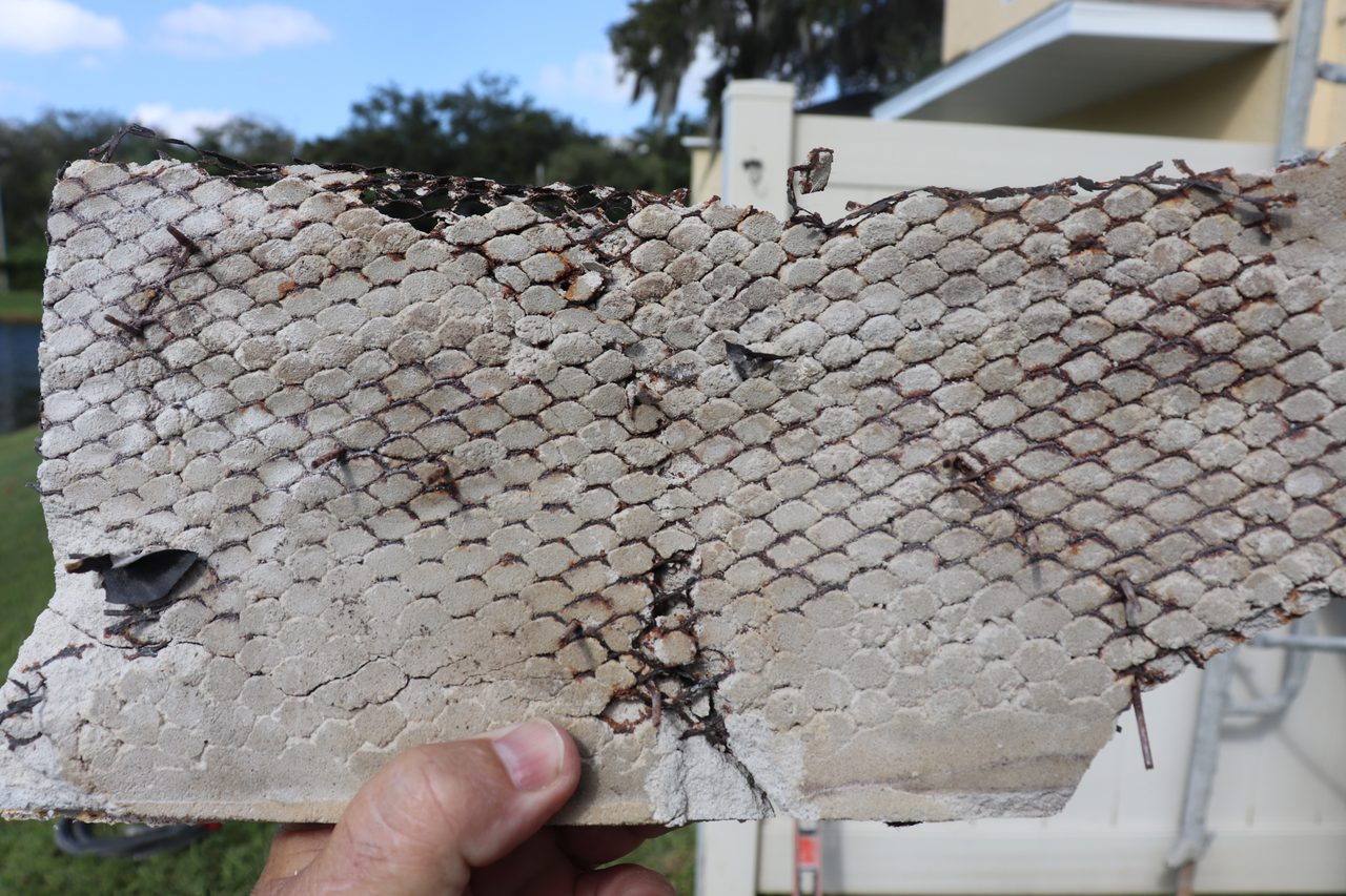 This type of corrosion, resulting from lack of embedment, can stay on the wall for many years and then finally, give away from a storm or wind event.