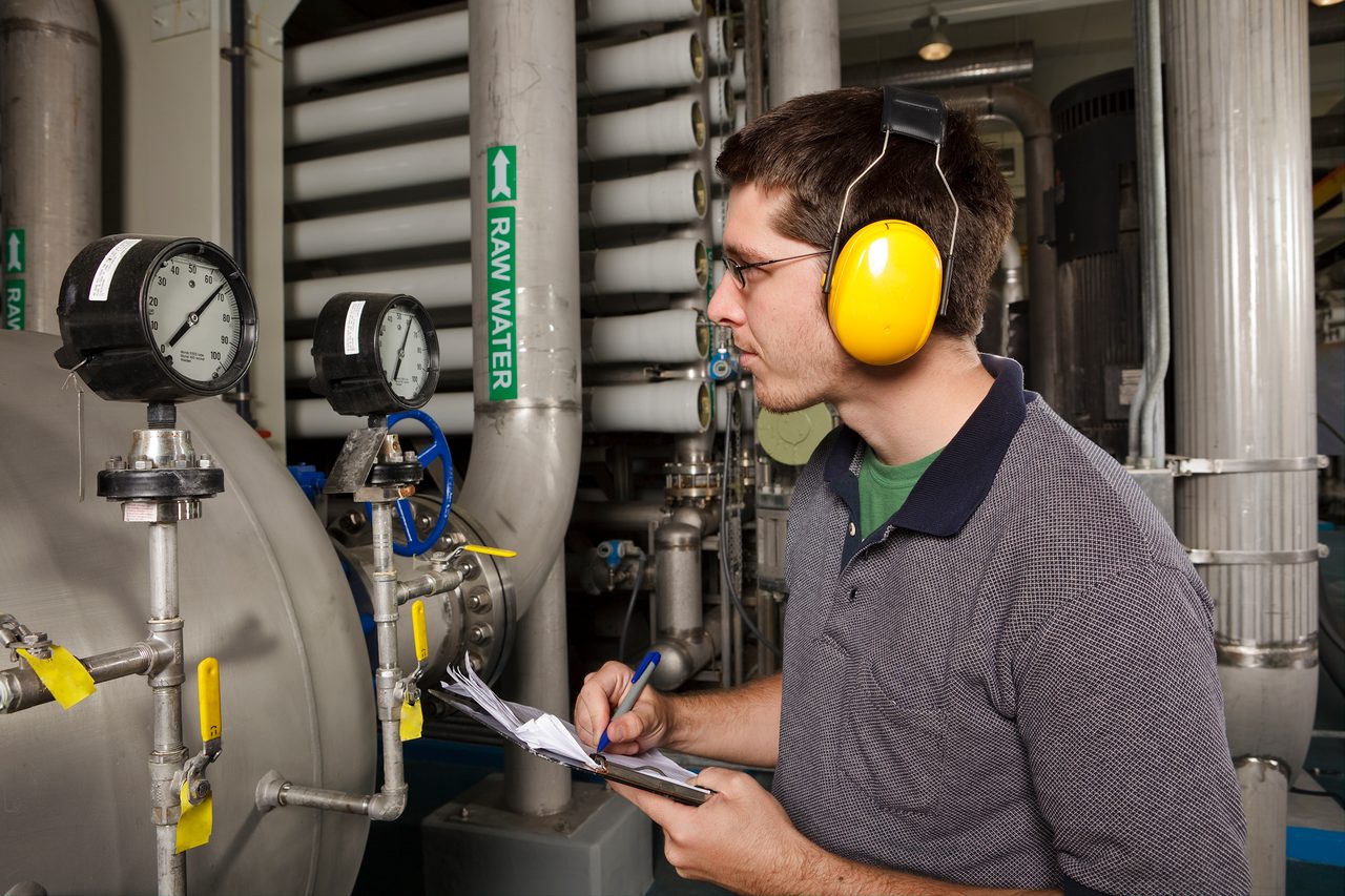 Reverse Osmosis Water Purification Plant Technician Checks System Settings