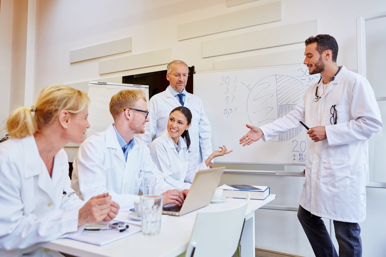 Health care provider, White coat, Medical assistant, Smile, Table, Laptop, Researcher