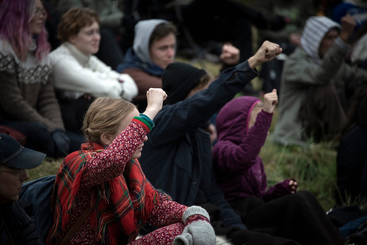 Social group, Hairstyle, Vertebrate, Human, Mammal, Interaction, Community, Grass, Crowd, Jacket