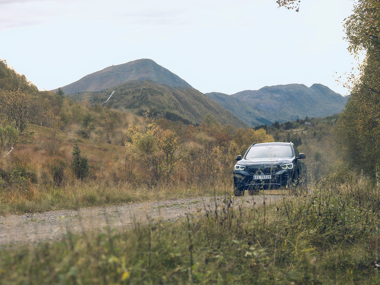 Vehicle registration plate, Automotive tire, Sky, Wheel, Car, Plant, Mountain, Cloud
