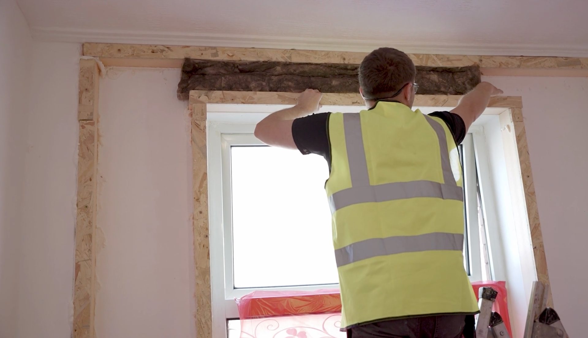 Photo of internal wall insulation being put in above a window
