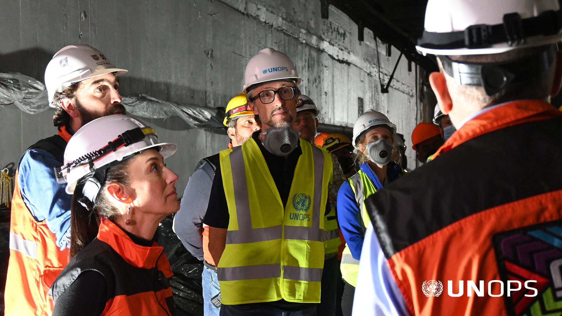 Hard hat, High-visibility clothing, Workwear, Helmet, Sunglasses, Engineer, Gesture, Headgear