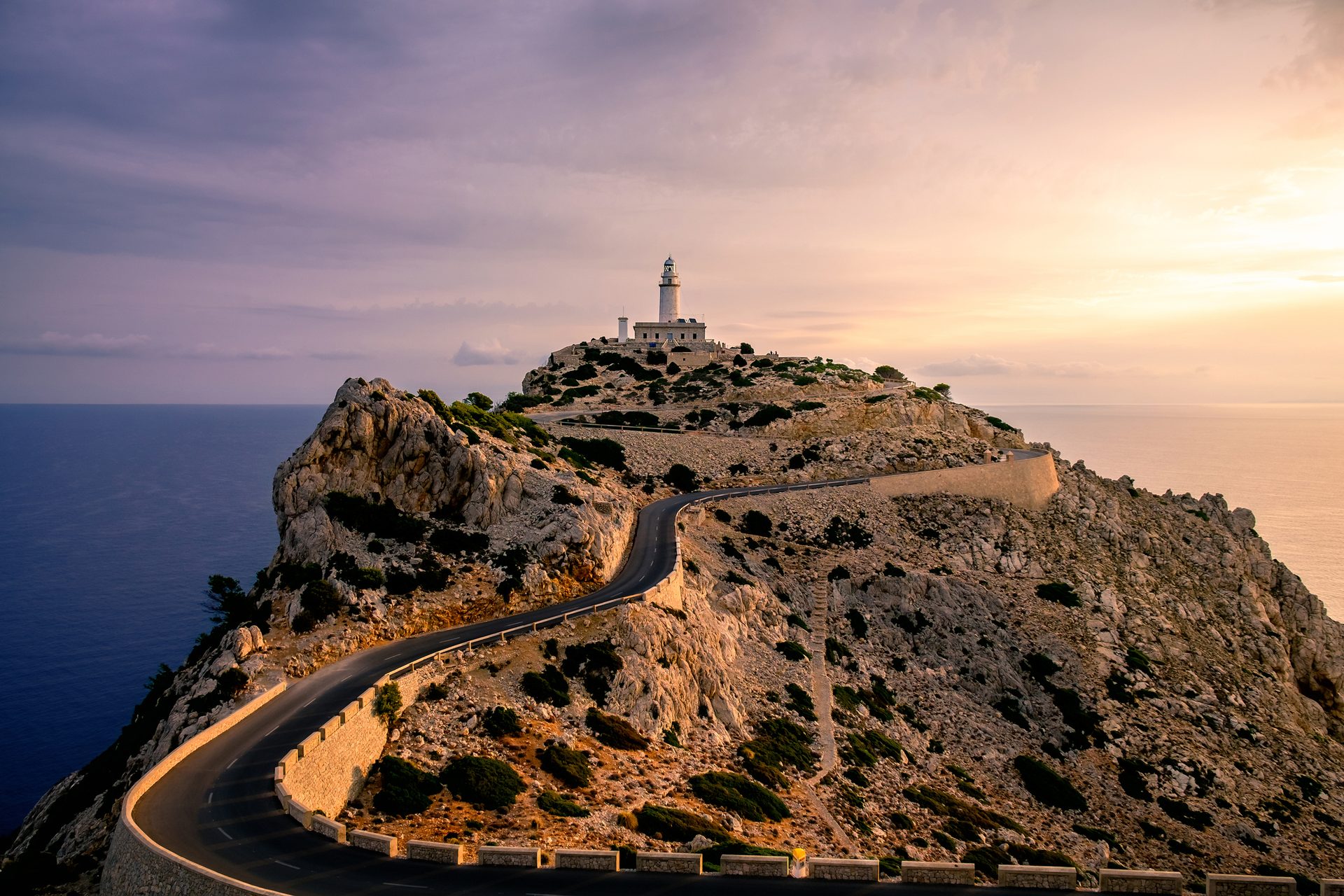 Coastal and oceanic landforms, Cloud, Sky, Lighthouse, Water, Mountain, Tower, Highland, Plant, Terrain
