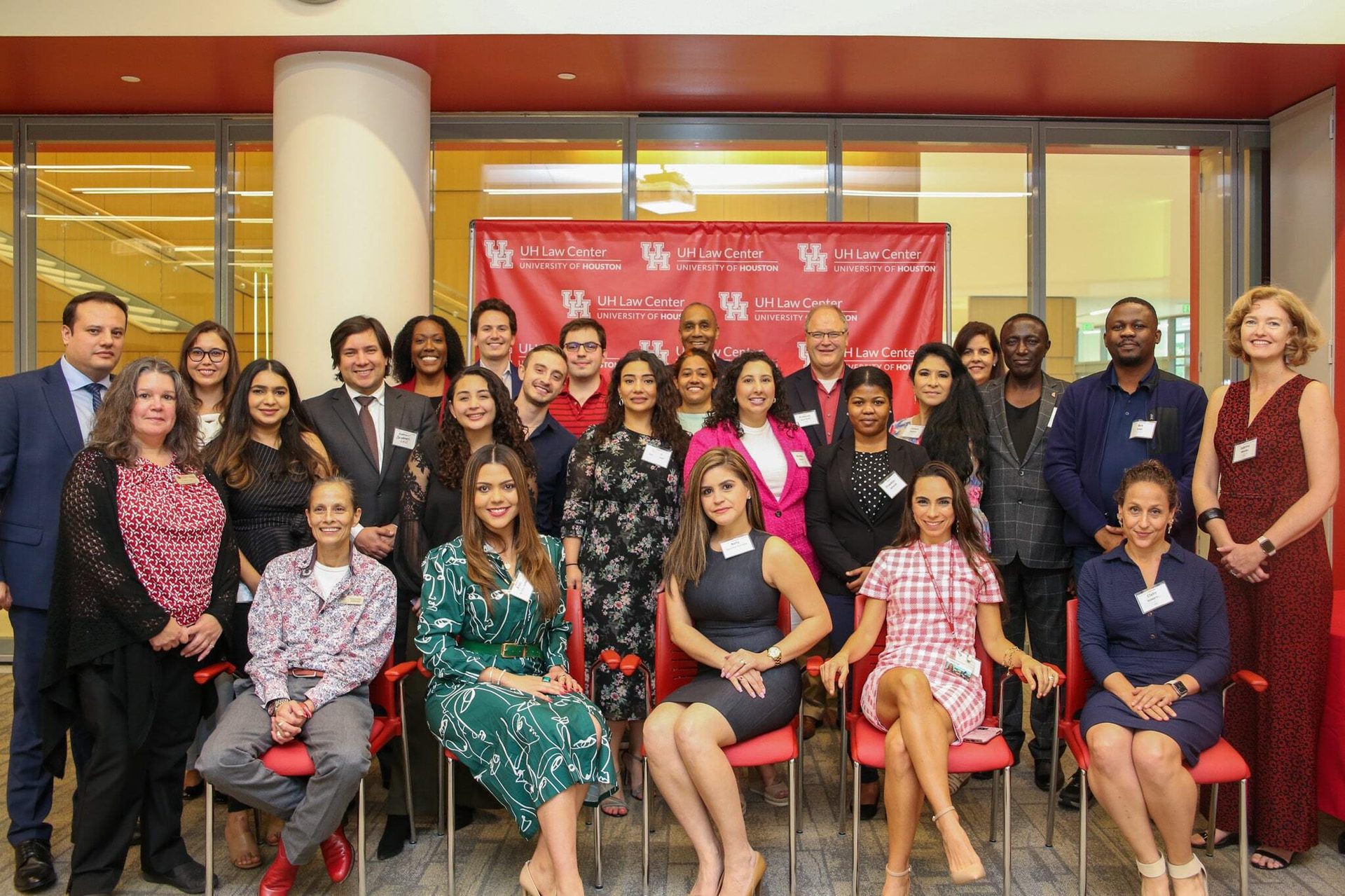 Social group, Facial expression, Smile, Face, Trousers, Standing, Youth, Dress, Happiness, Waist