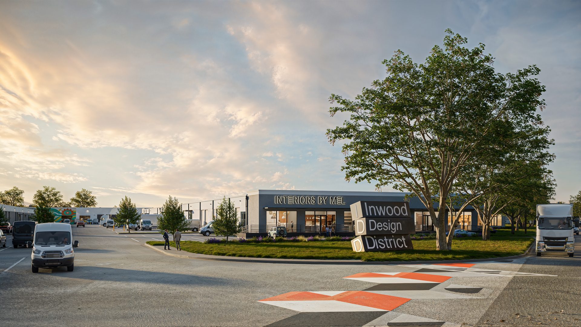 Commercial building "Interiors by Mel" in Inwood Design District, with vehicles, trees, at sunset.