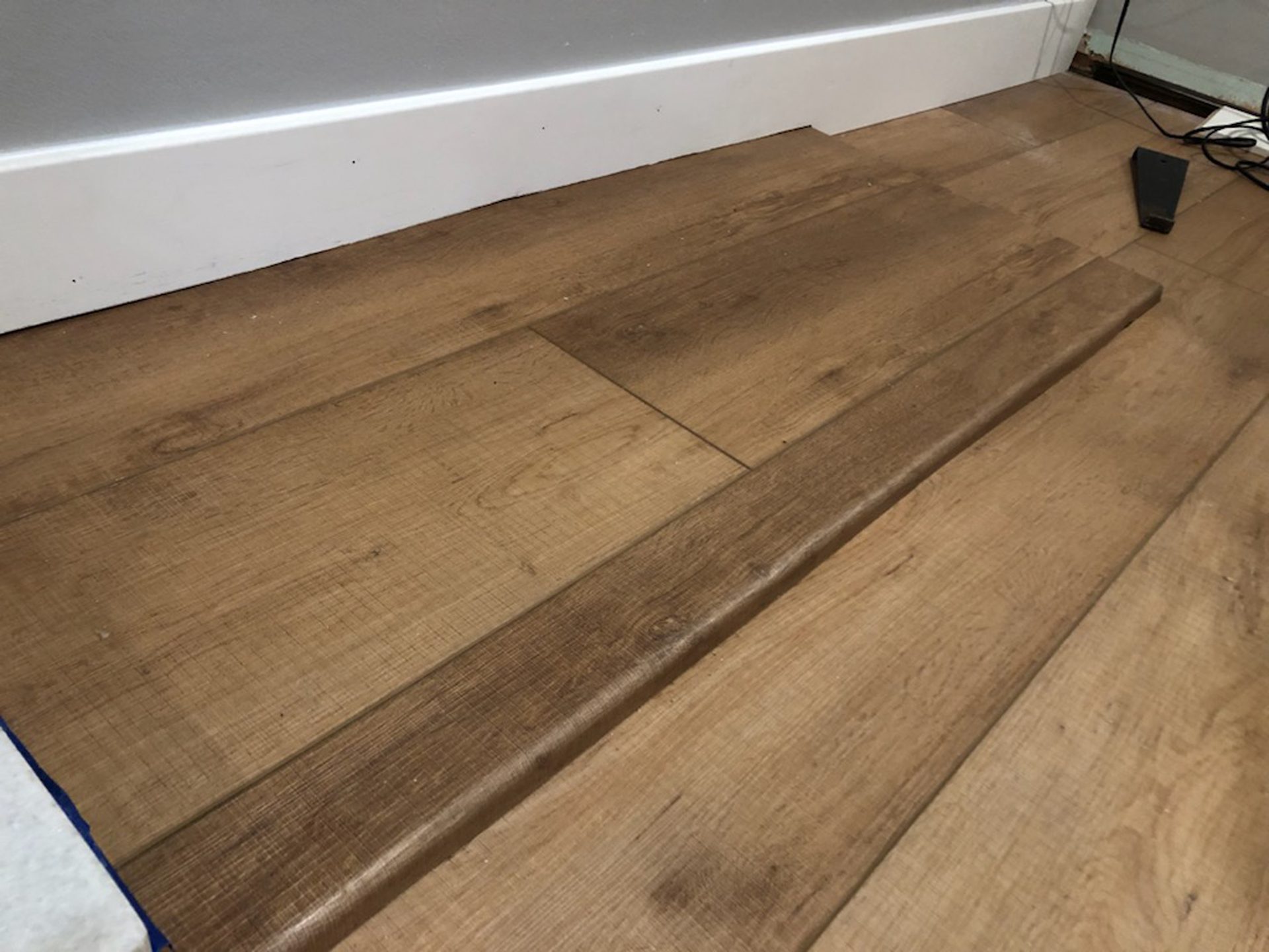 Wood stain, Building material, Brown, Rectangle, Flooring, Floor