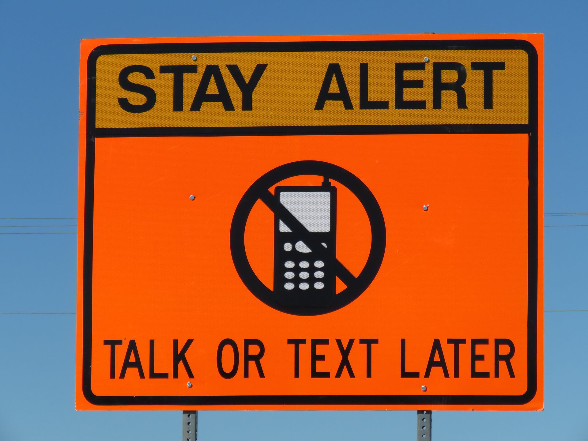 Motor vehicle, Traffic sign, Rectangle, Font