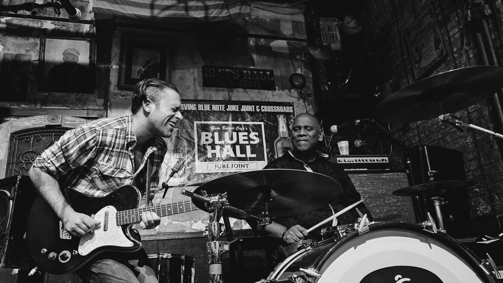 Band plays, Musical instrument, Membranophone, Idiophone, Drum, Photograph, Musician, Cymbal, Drumhead, Black