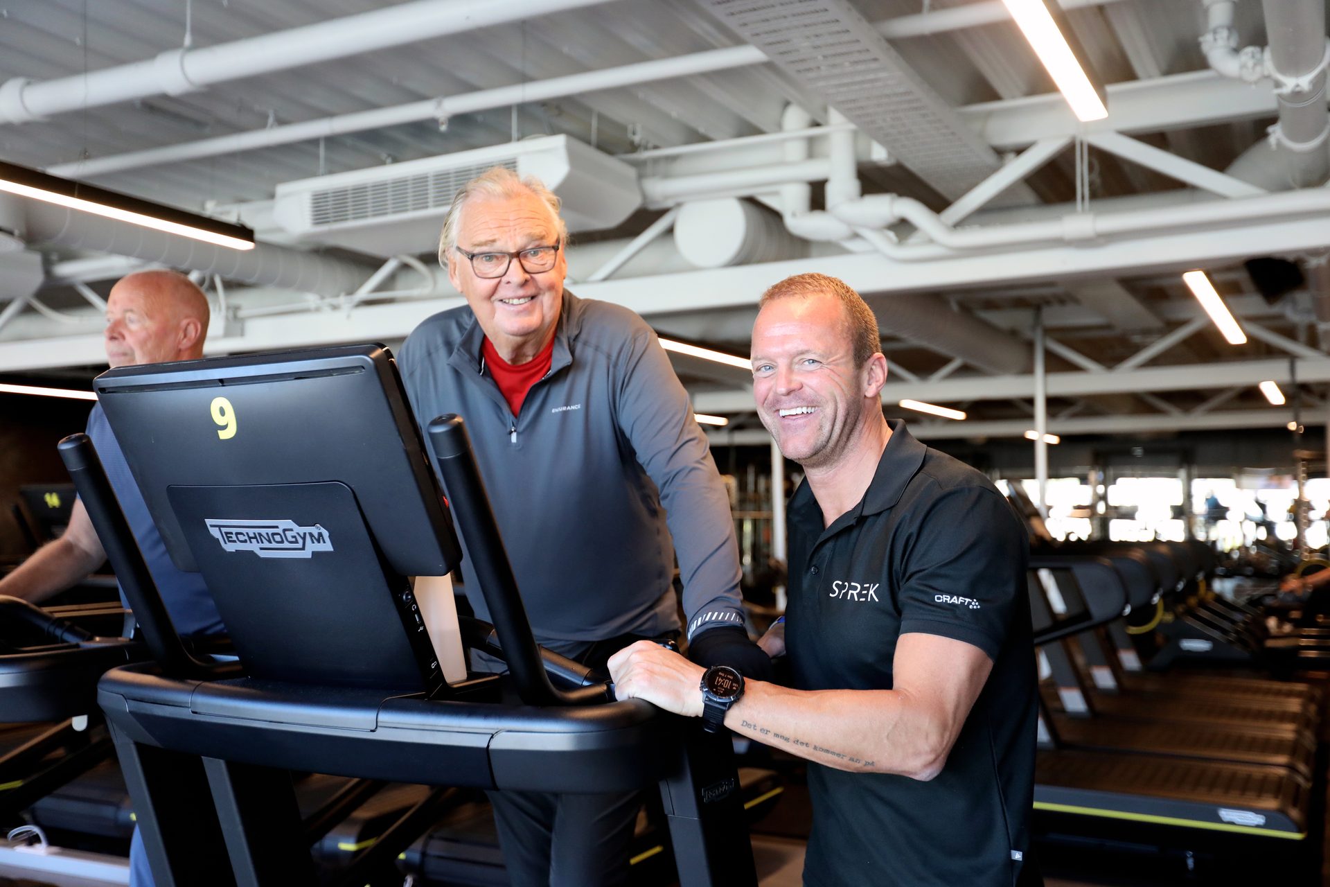 Personal computer, Motor vehicle, Automotive design, Smile, Muscle, Workwear, Chair