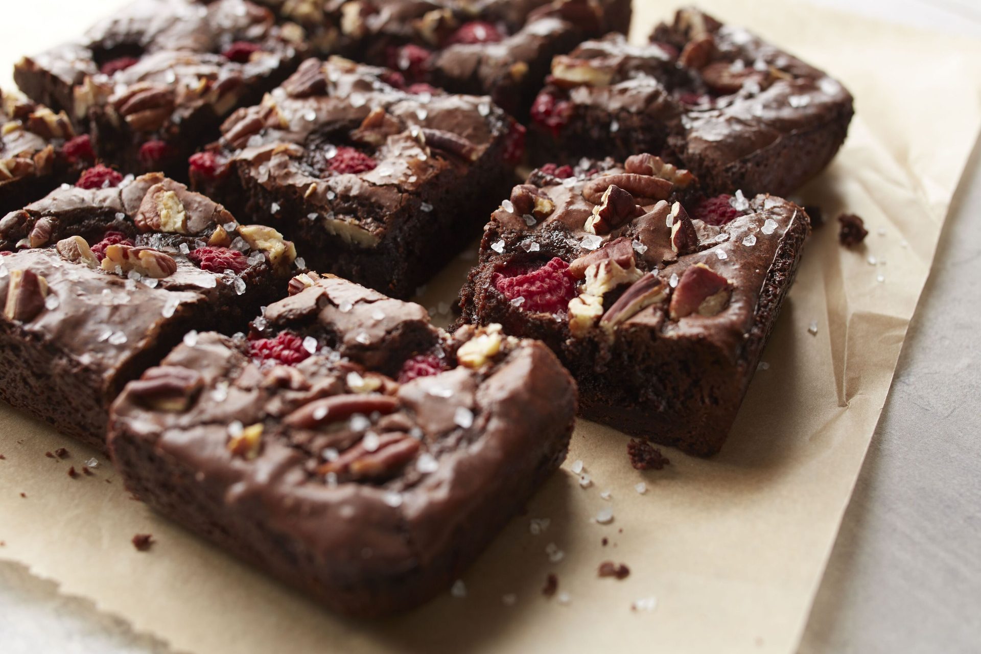 Cut-up brownies containing nuts and berries