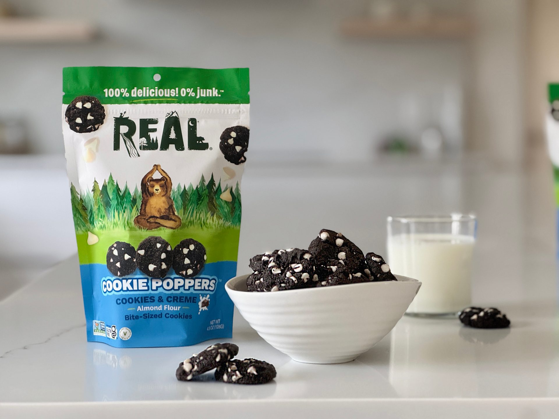 Real Cookie Poppers in Cookies & Crème flavor, with almond flour, in green, white, and blue packaging.