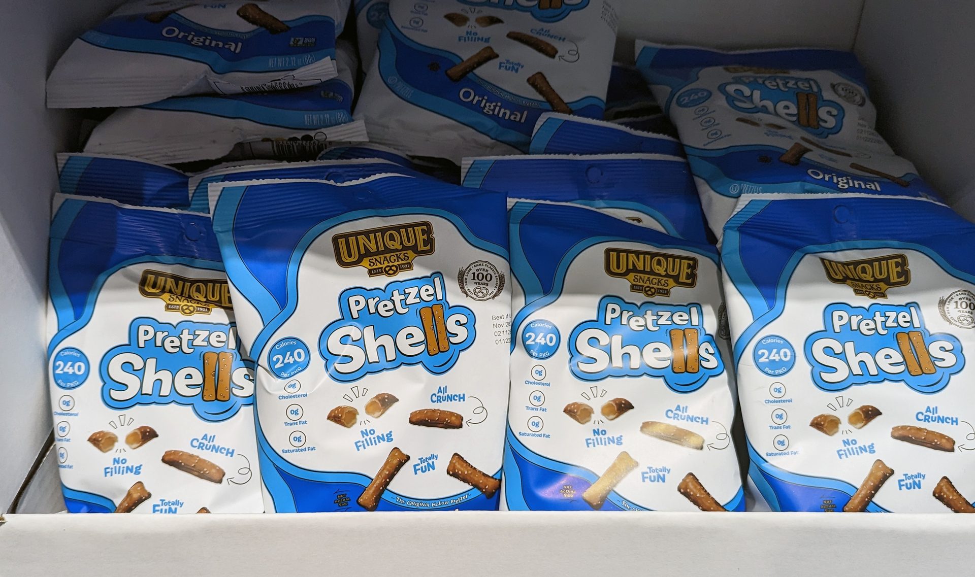 Bags of Unique Snacks Pretzel Shells, an "all crunch" hollow pretzel.