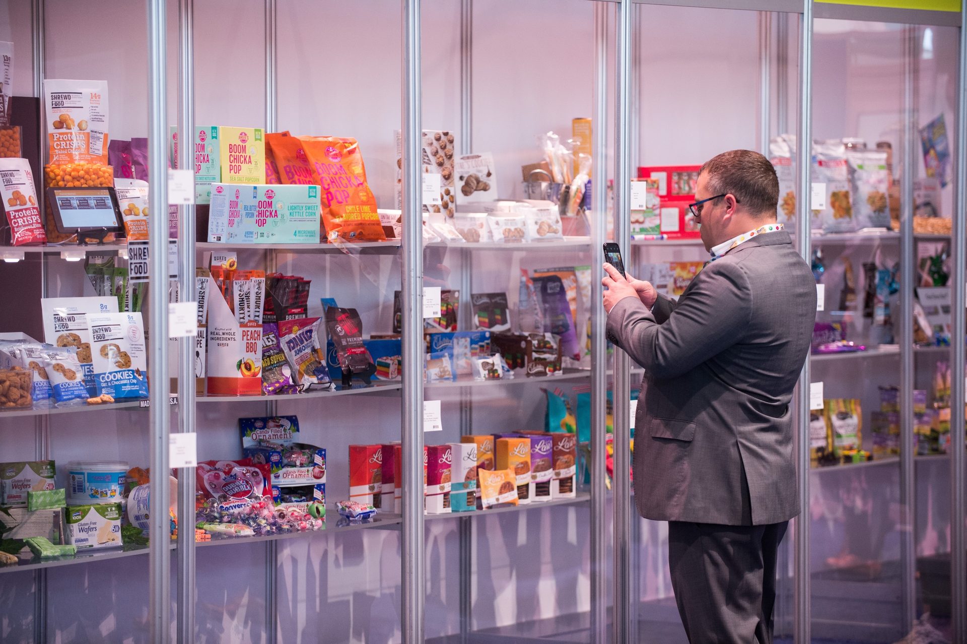 Interior photo, Display rack, Colorful packages, Man in suit