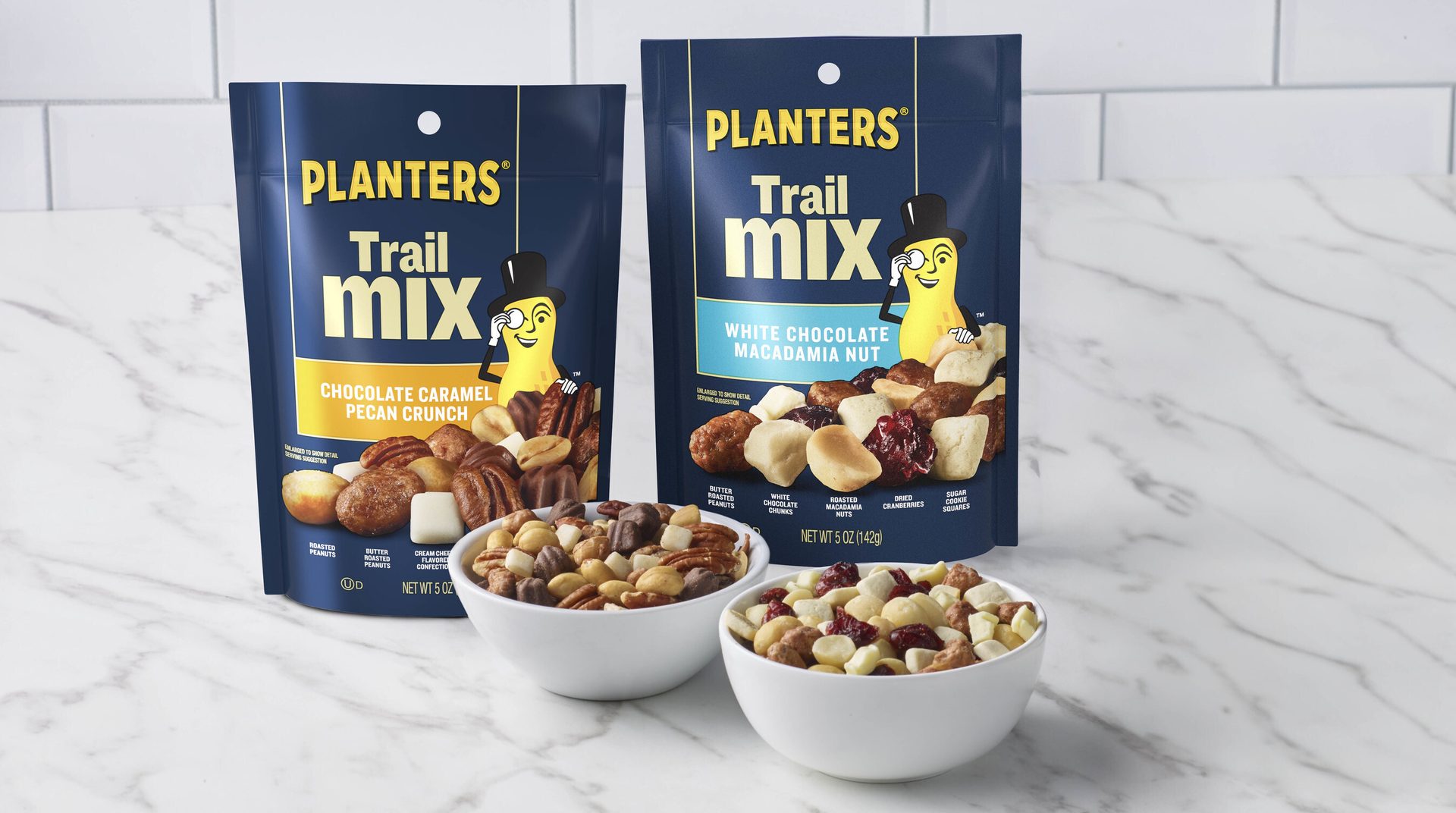 Two Planters Trail Mix bags (Chocolate Caramel Pecan Crunch, White Chocolate Macadamia Nut) and bowls.
