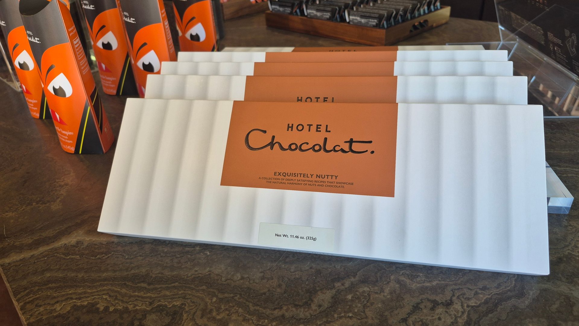 Hotel Chocolat "Exquisitely Nutty" chocolate slabs and "Vampire" themed boxes on display.