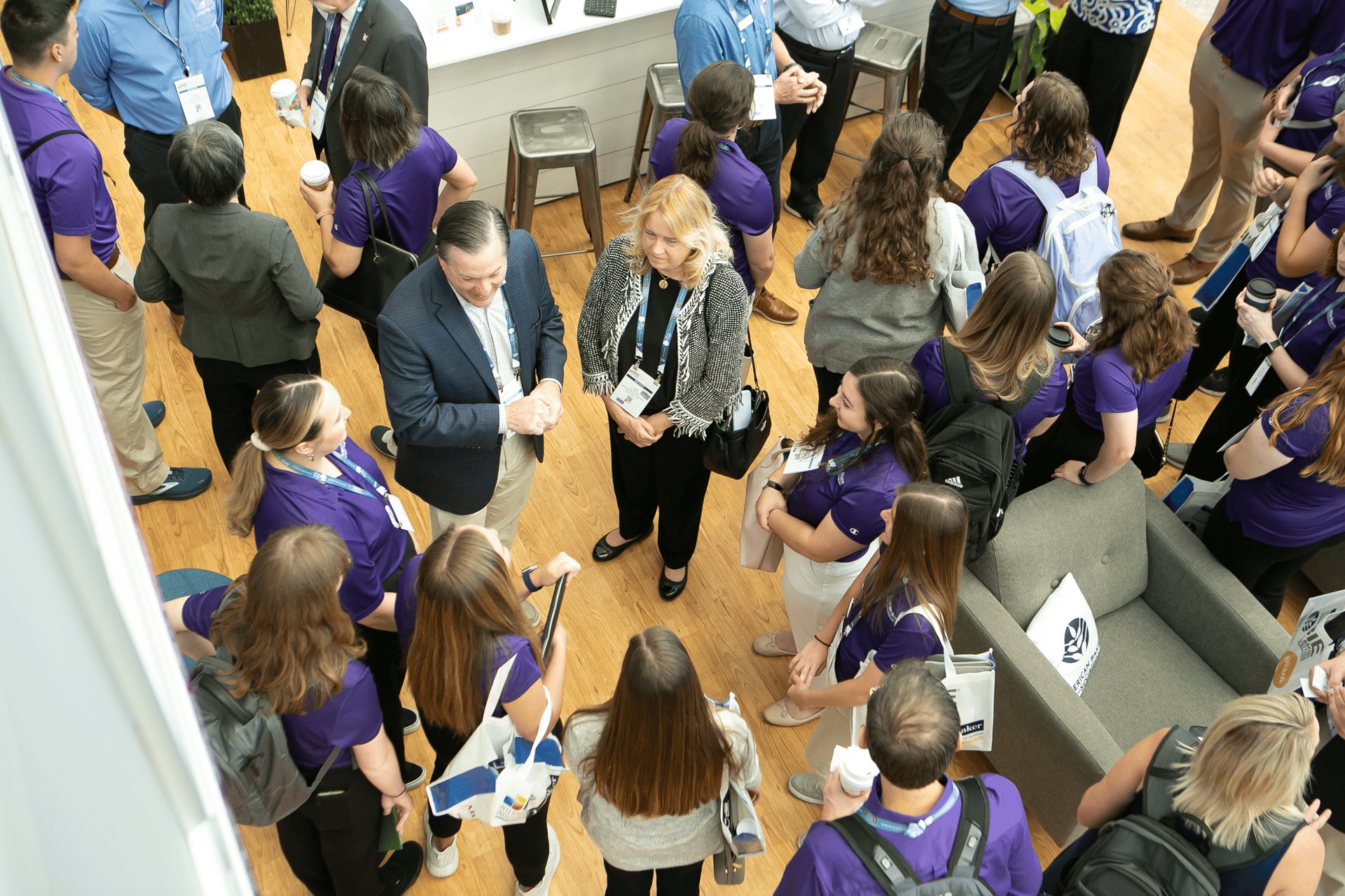 Overhead shot of people in exhibit booth