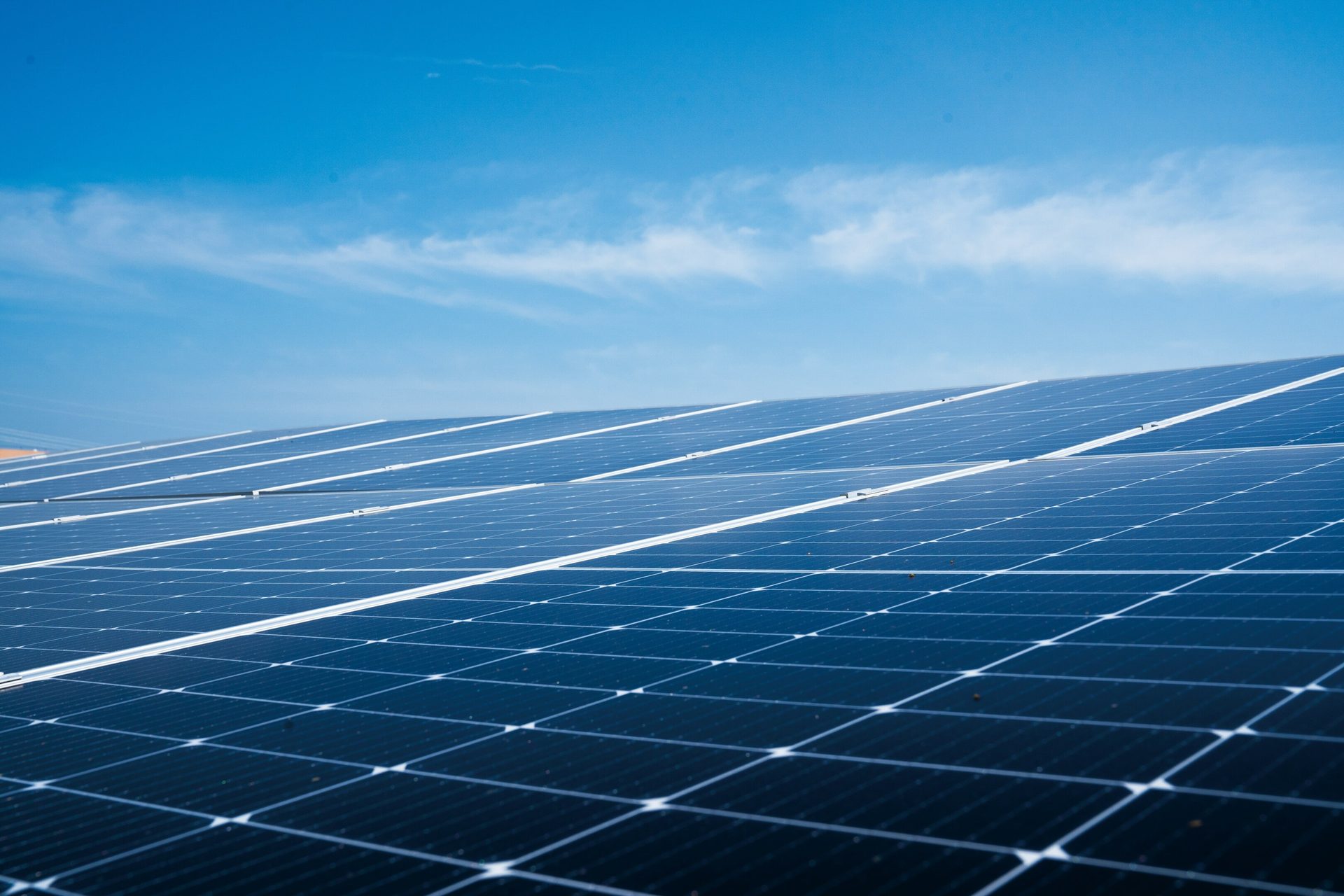 Solar panels against a blue sky.