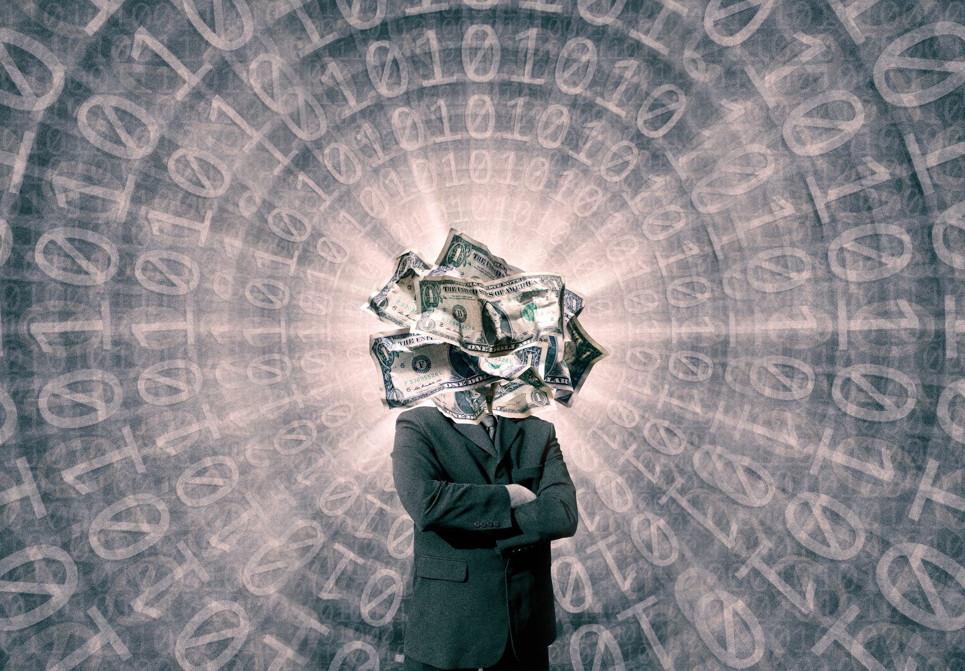Businessman with a head made of crumpled US dollar bills stands against a background of binary code.