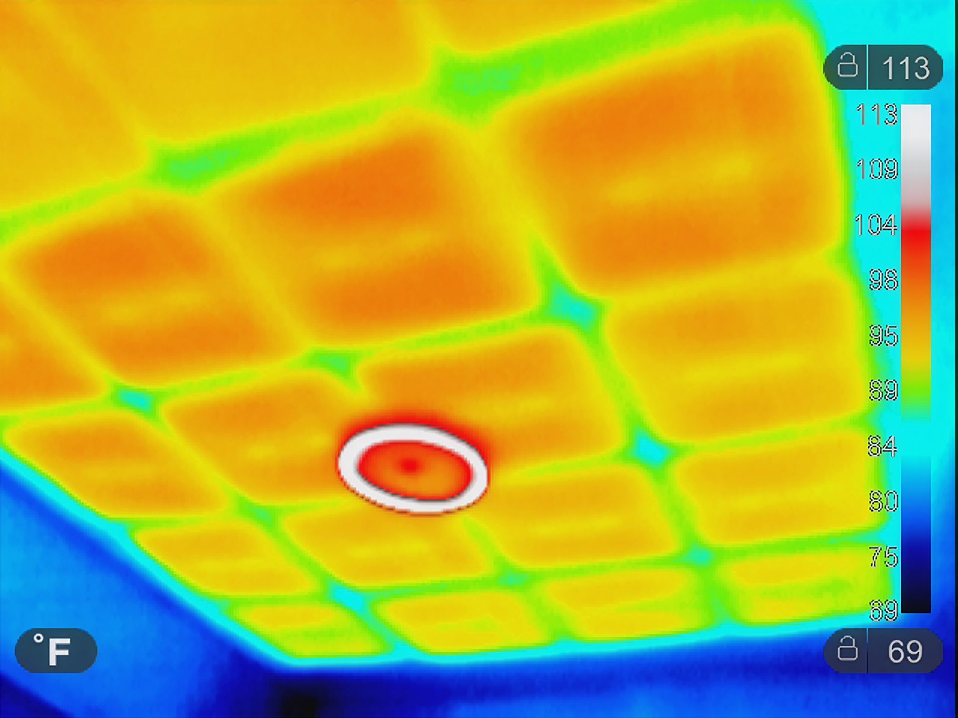 Thermal image of a ceiling grid, highlighting a hot central vent and varied temperatures (69-113°F).