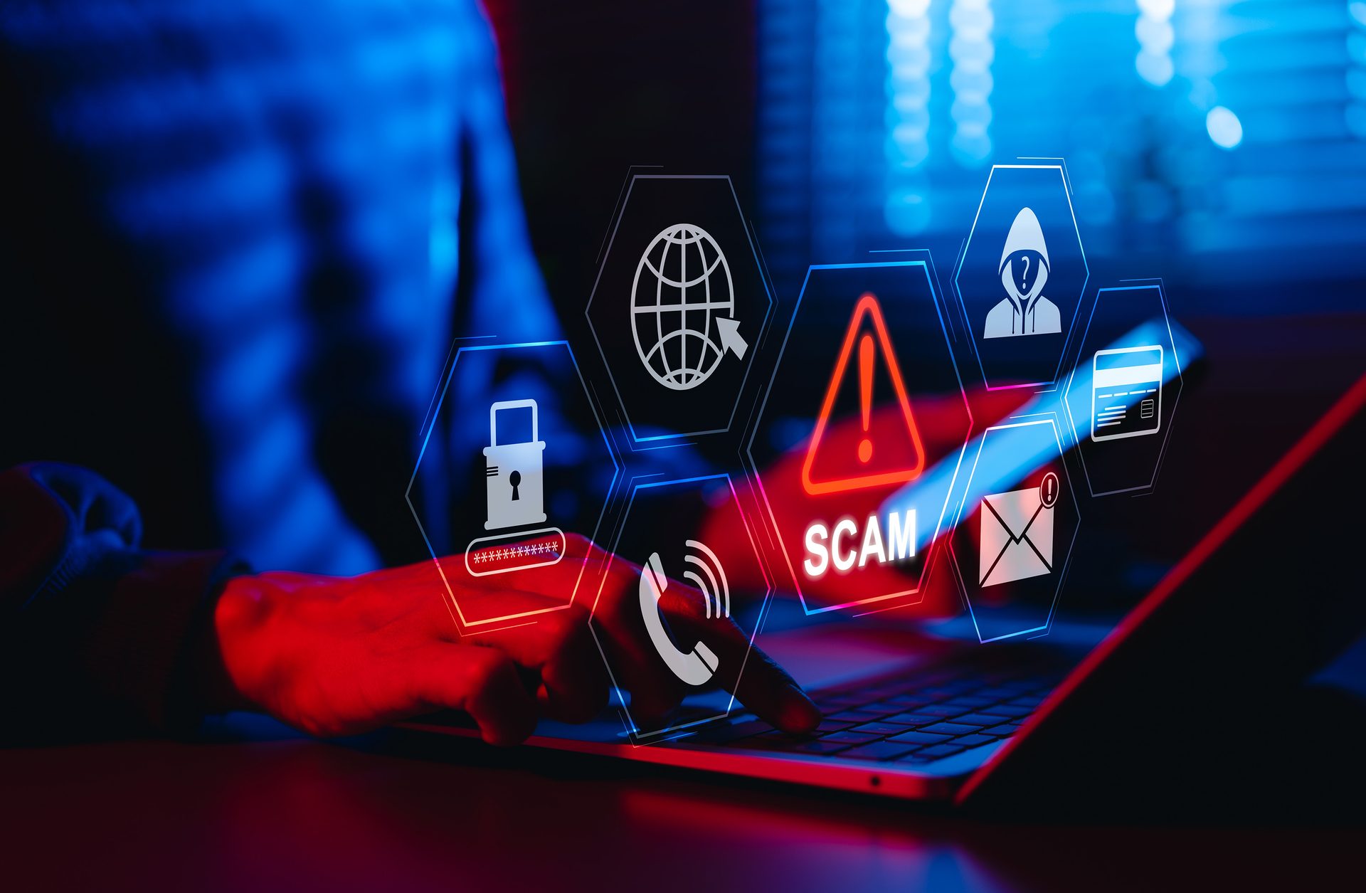 Laptop user with holographic cyber threat icons, including a 'SCAM' warning.