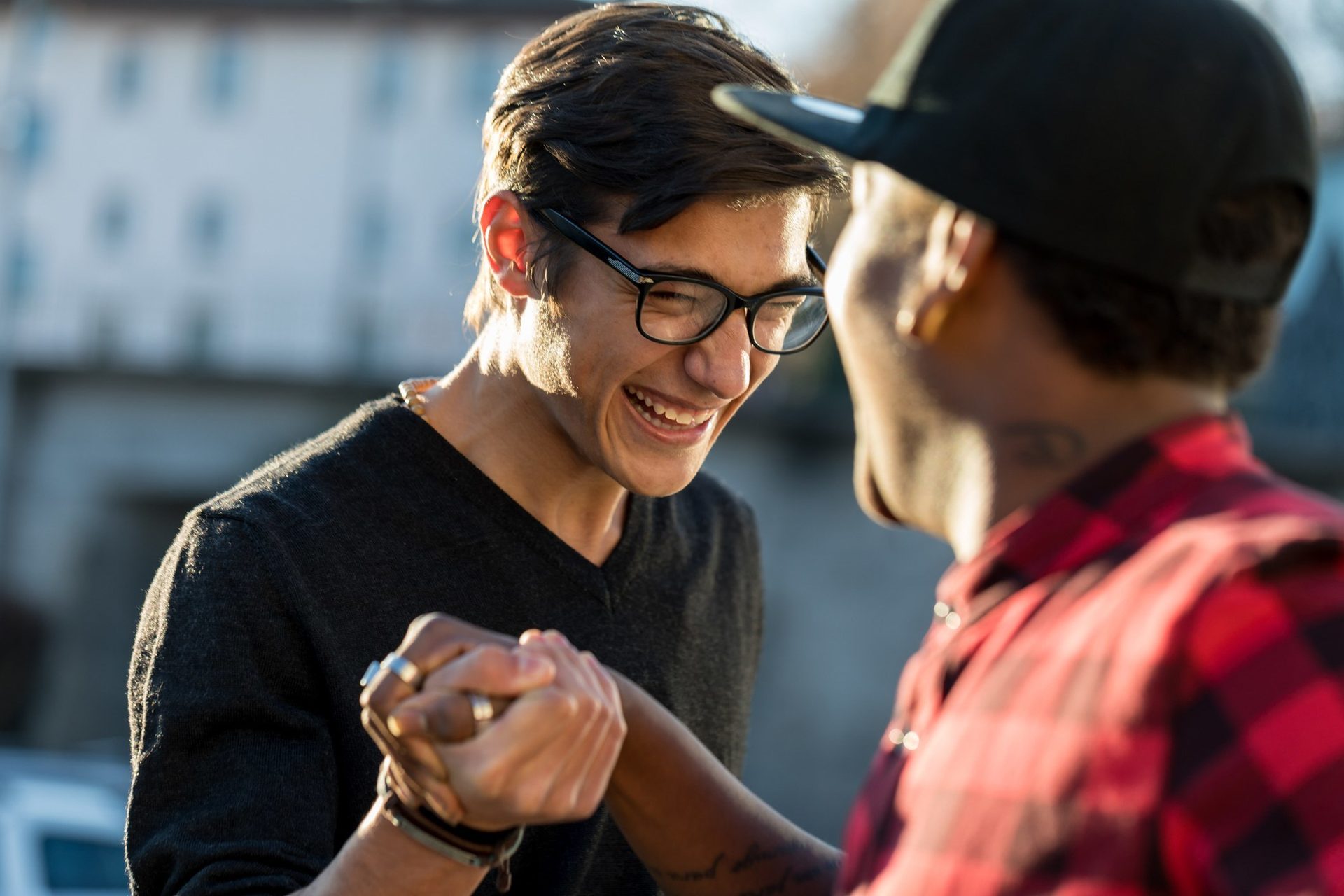 Vision care, Baseball cap, Glasses, Smile, Hand, Hairstyle, Eyewear, Gesture, Happy