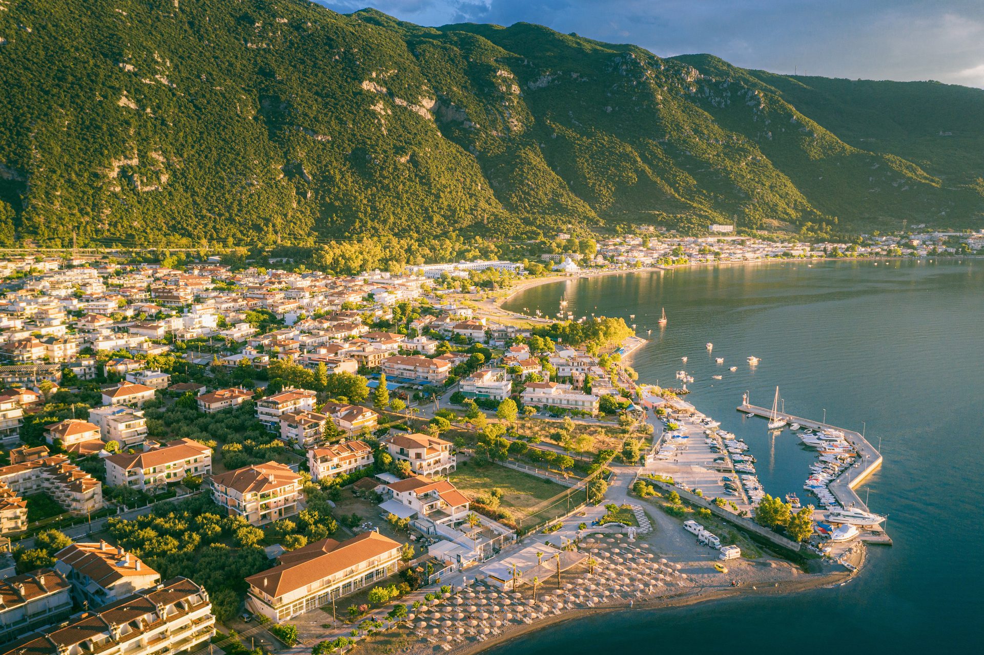 Coastal and oceanic landforms, Body of water, Natural landscape, Mountain, Sky, Cloud, Building, Nature