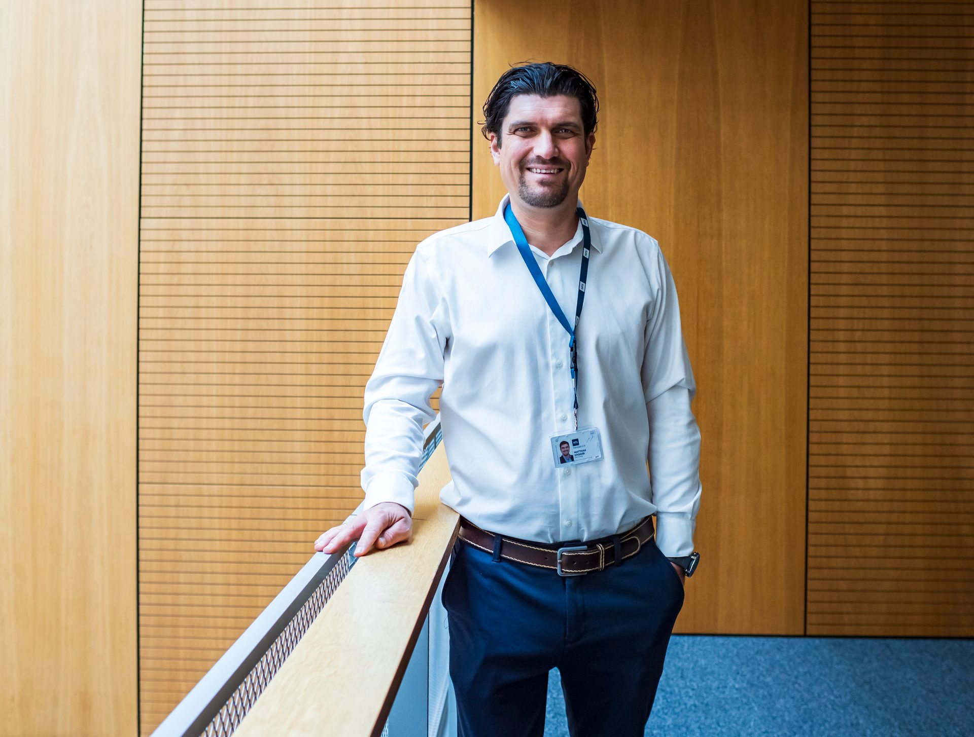 Facial expression, Dress shirt, Formal wear, White-collar worker, Sleeve, Shoulder, Collar, Smile, Standing, Happiness