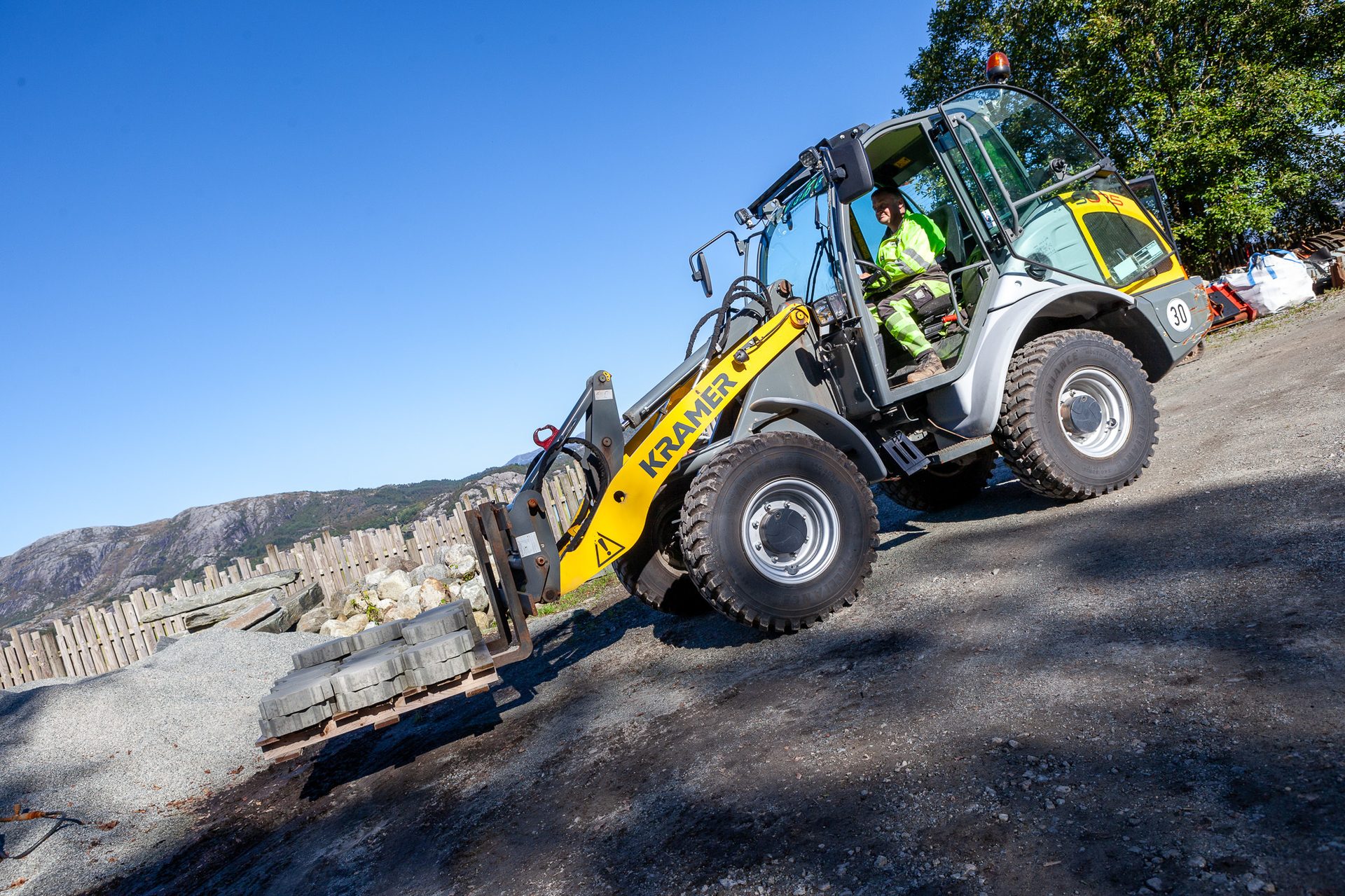 Automotive tire, Motor vehicle, Road surface, Wheel, Sky, Tread, Asphalt, Slope