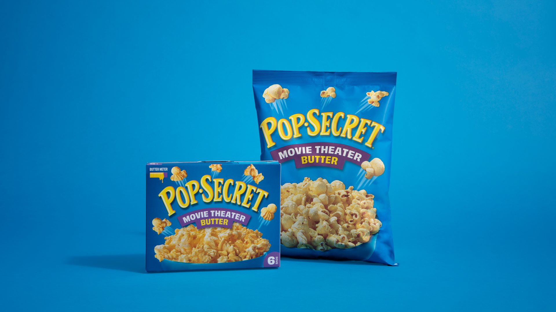 Pop-Secret Movie Theater Butter popcorn in both a box of microwave bags and a large snack bag.