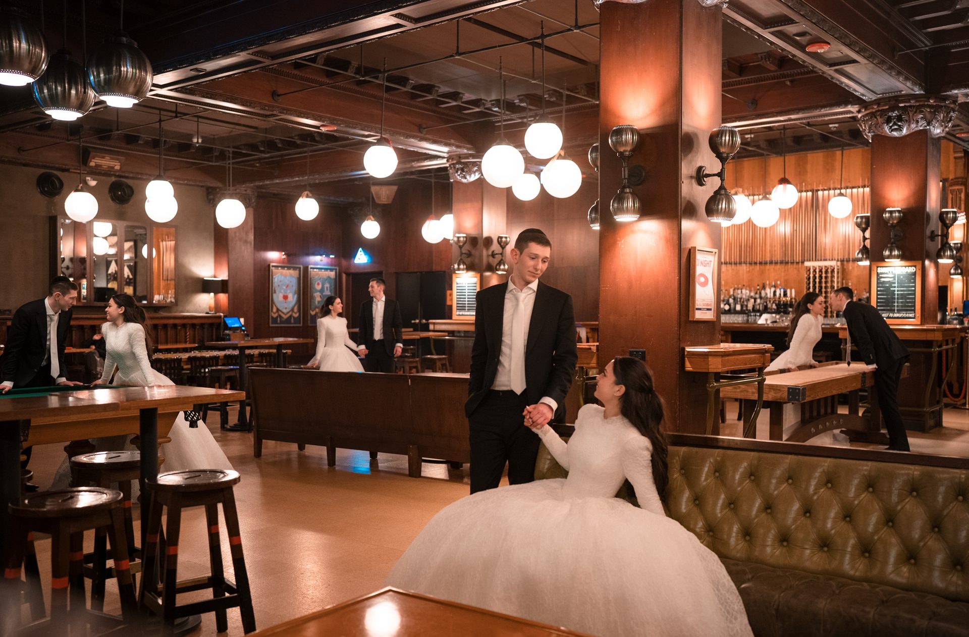 A couple in wedding attire appears multiple times in a dimly lit, vintage-style bar or lounge.