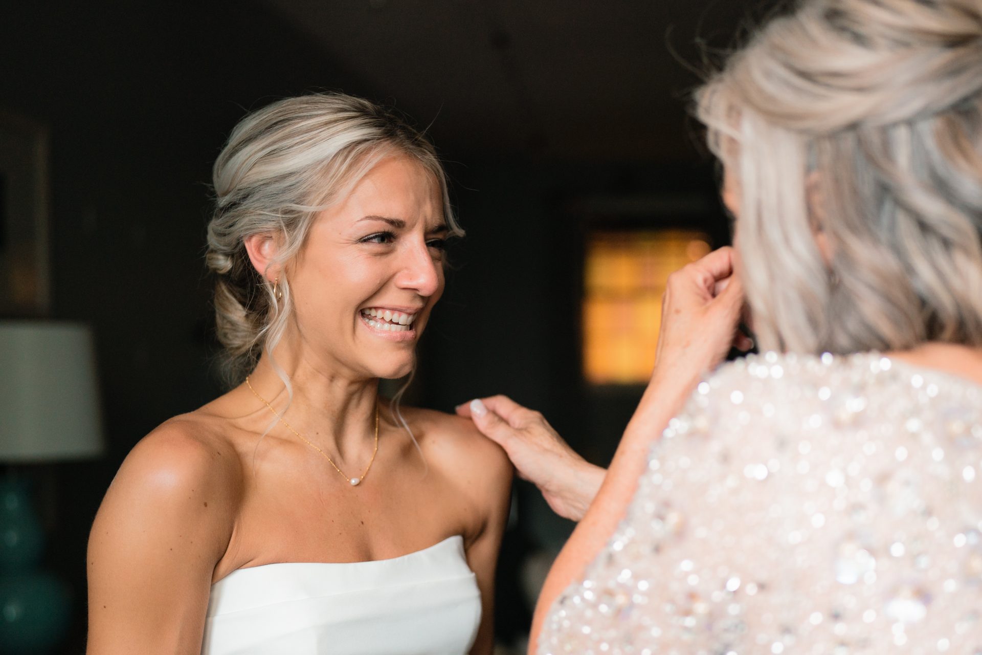 Wedding dress, Bridal clothing, Flash photography, Hair, Smile, Hairstyle, Shoulder, Human, Happy, Gesture