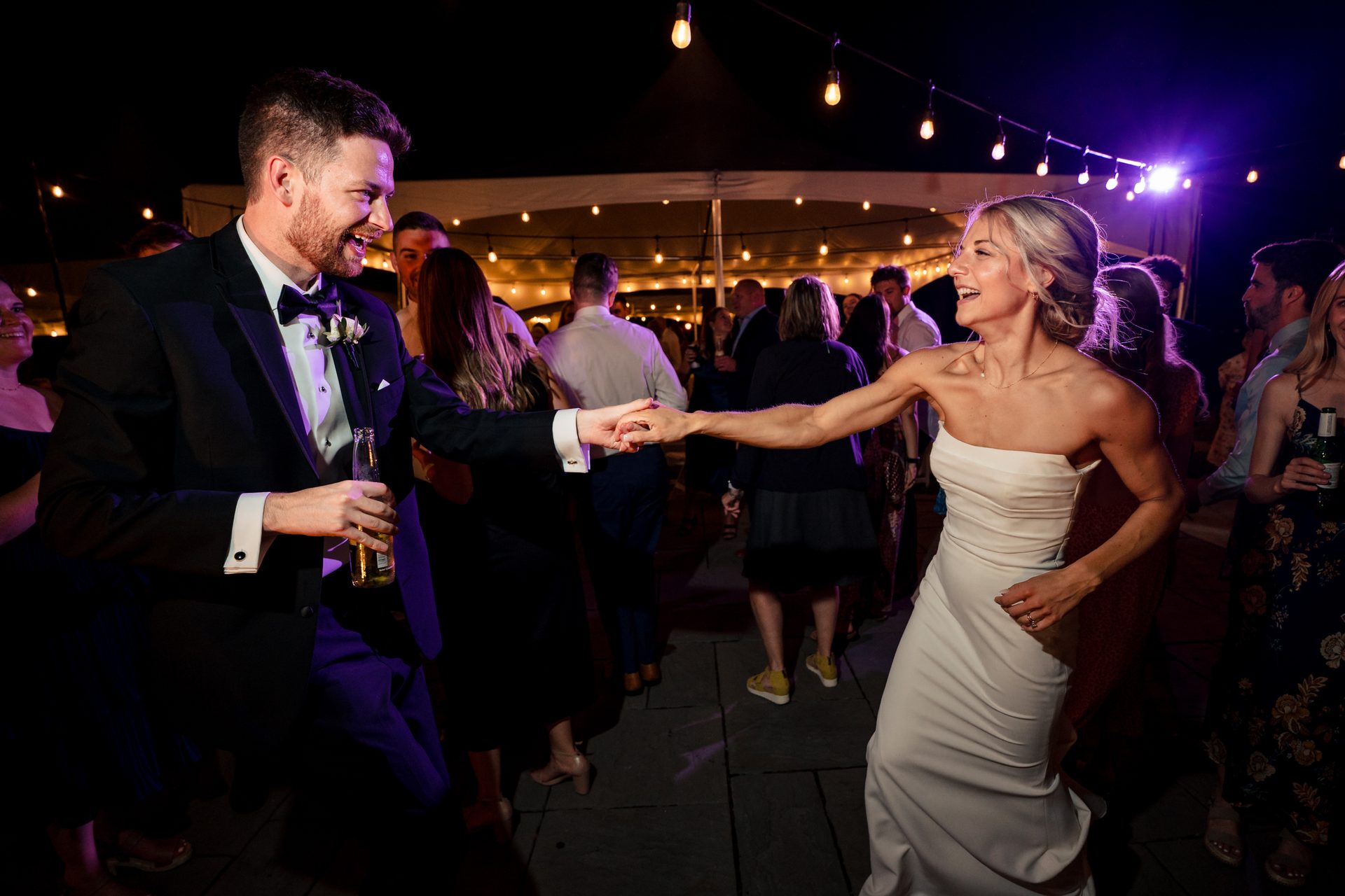 Flash photography, Smile, Purple, Dress, Lighting, Entertainment, Gesture, Interaction, Happy, Suit