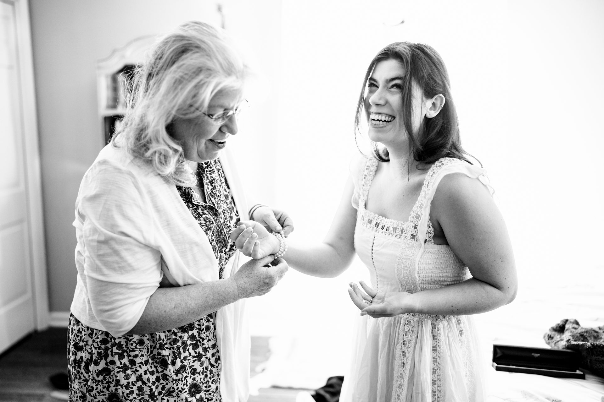 Flash photography, Hairstyle, Shoulder, Smile, Black, Black-and-white, Standing, Happy, Gesture, Style