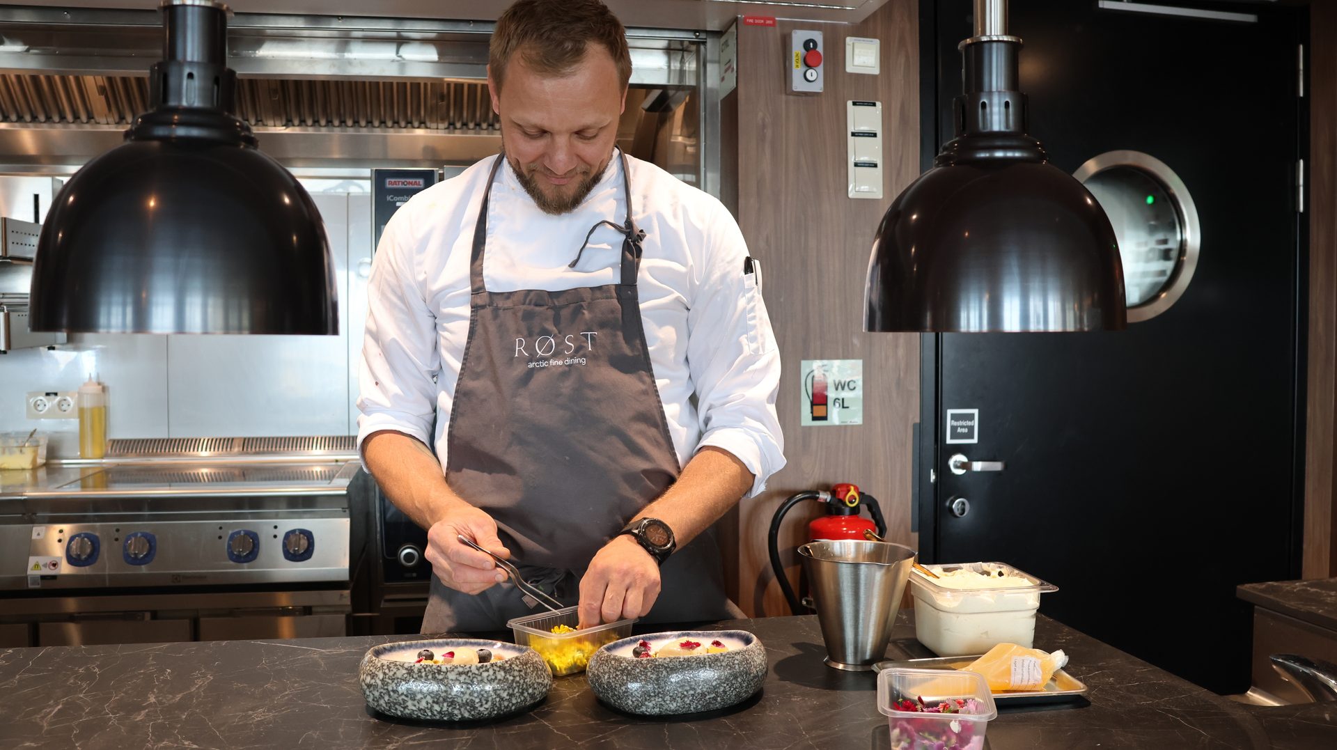 Chef's uniform, Kitchen appliance, Food, Tableware, Chef, Apron, Countertop, Cooking