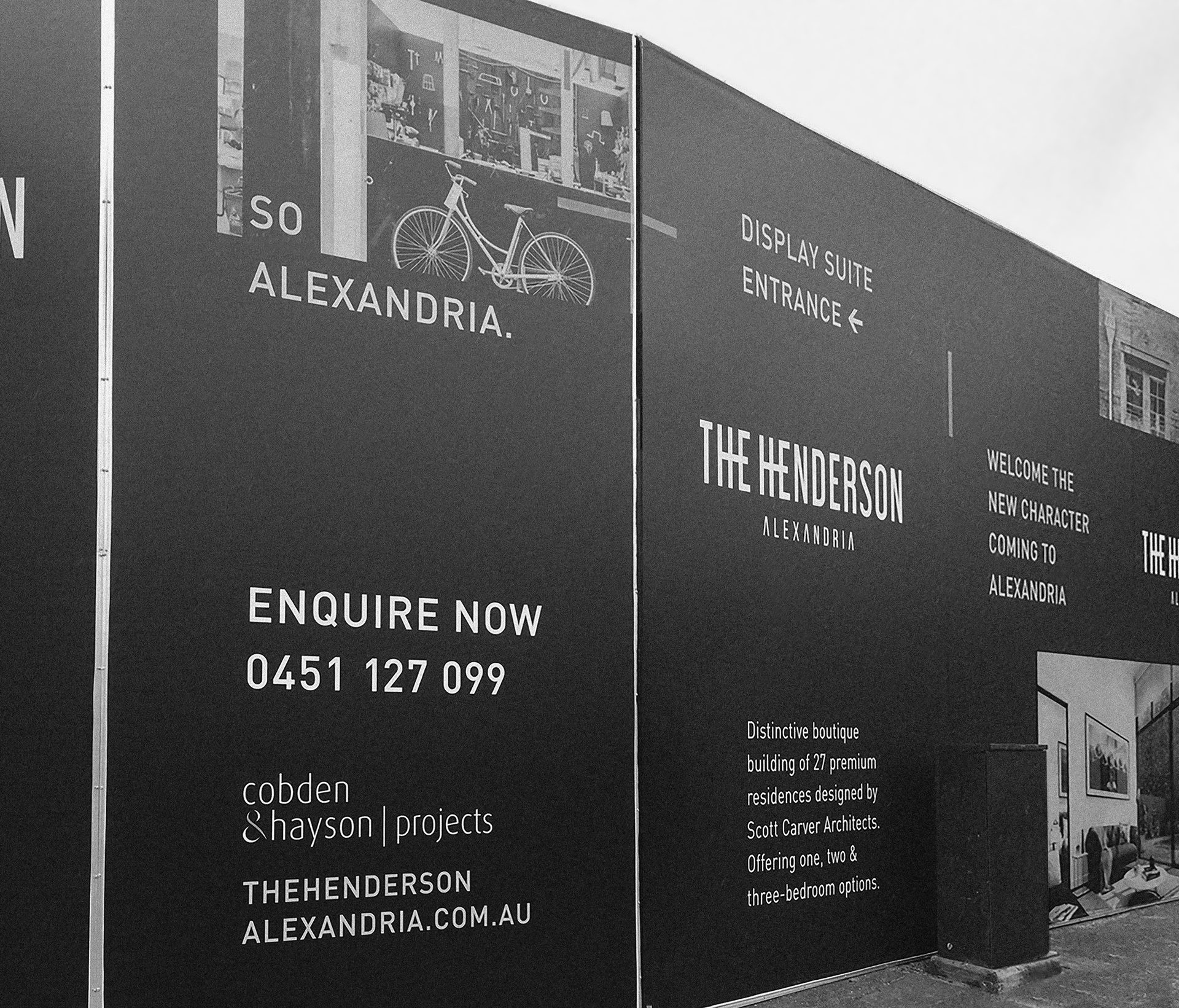 Black signage for 'The Henderson' residences in Alexandria, with project details and contact info.