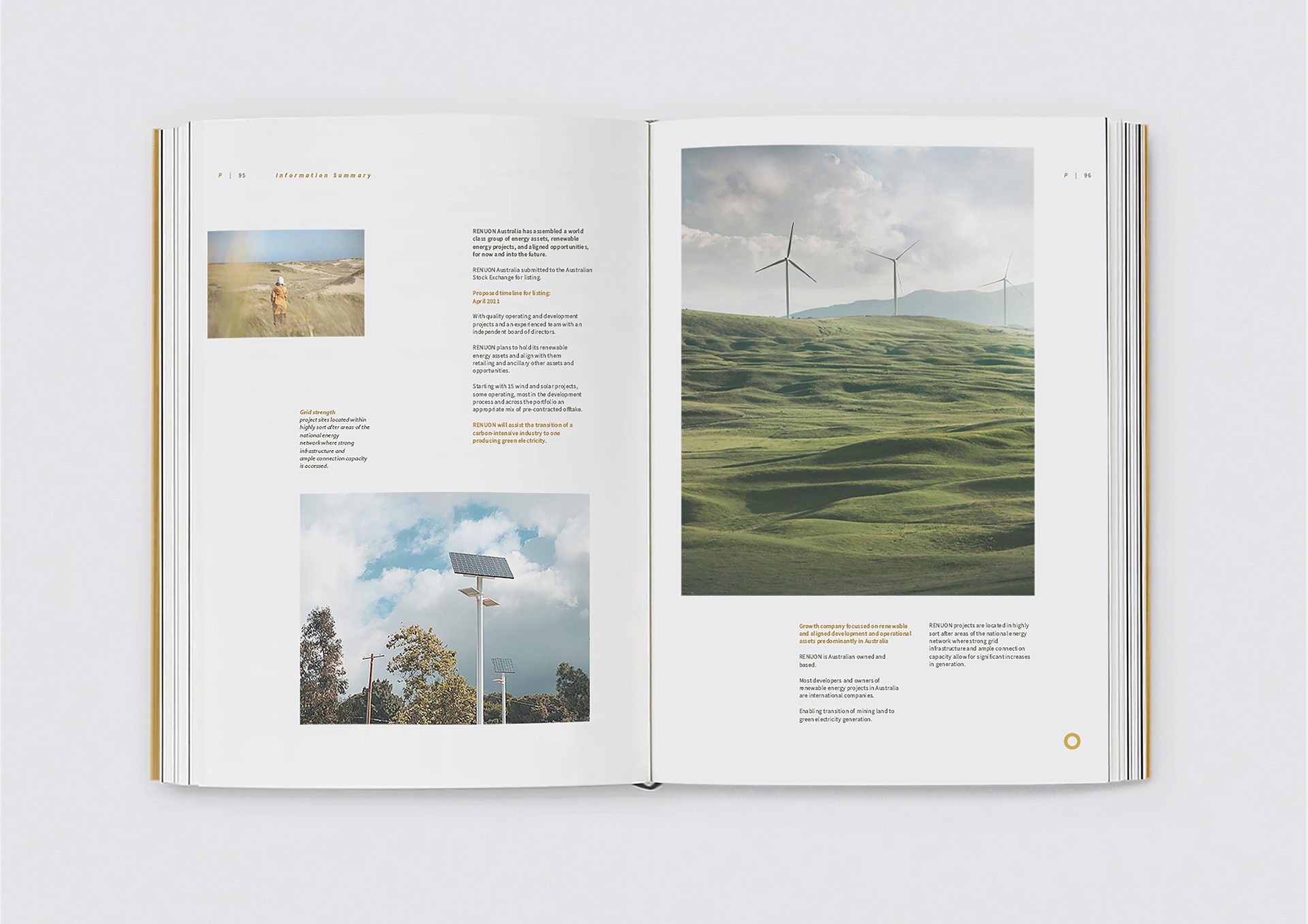 Open book displaying "Information Summary" about renewable energy, with wind turbines and solar panels.