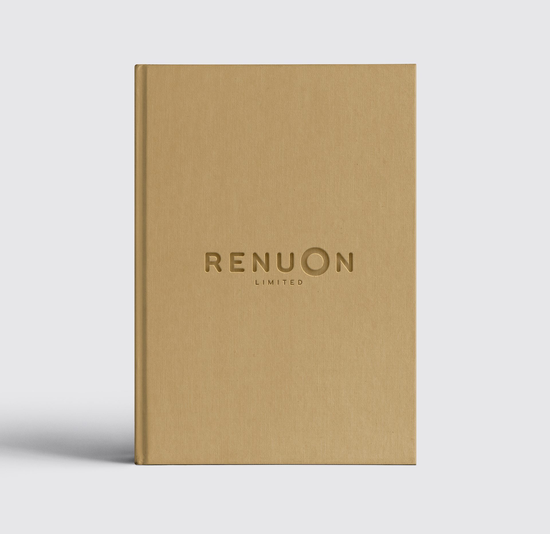 Light brown textured book with "RENUON LIMITED" debossed on the cover.